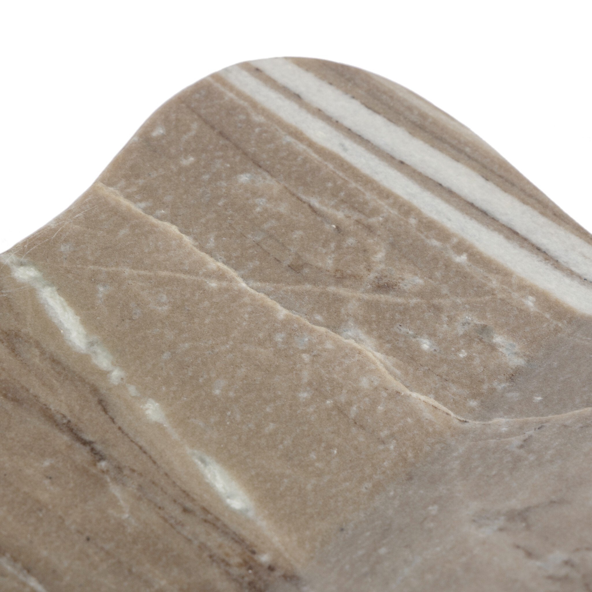 Rounded corner detail of a marble book holder on a white background