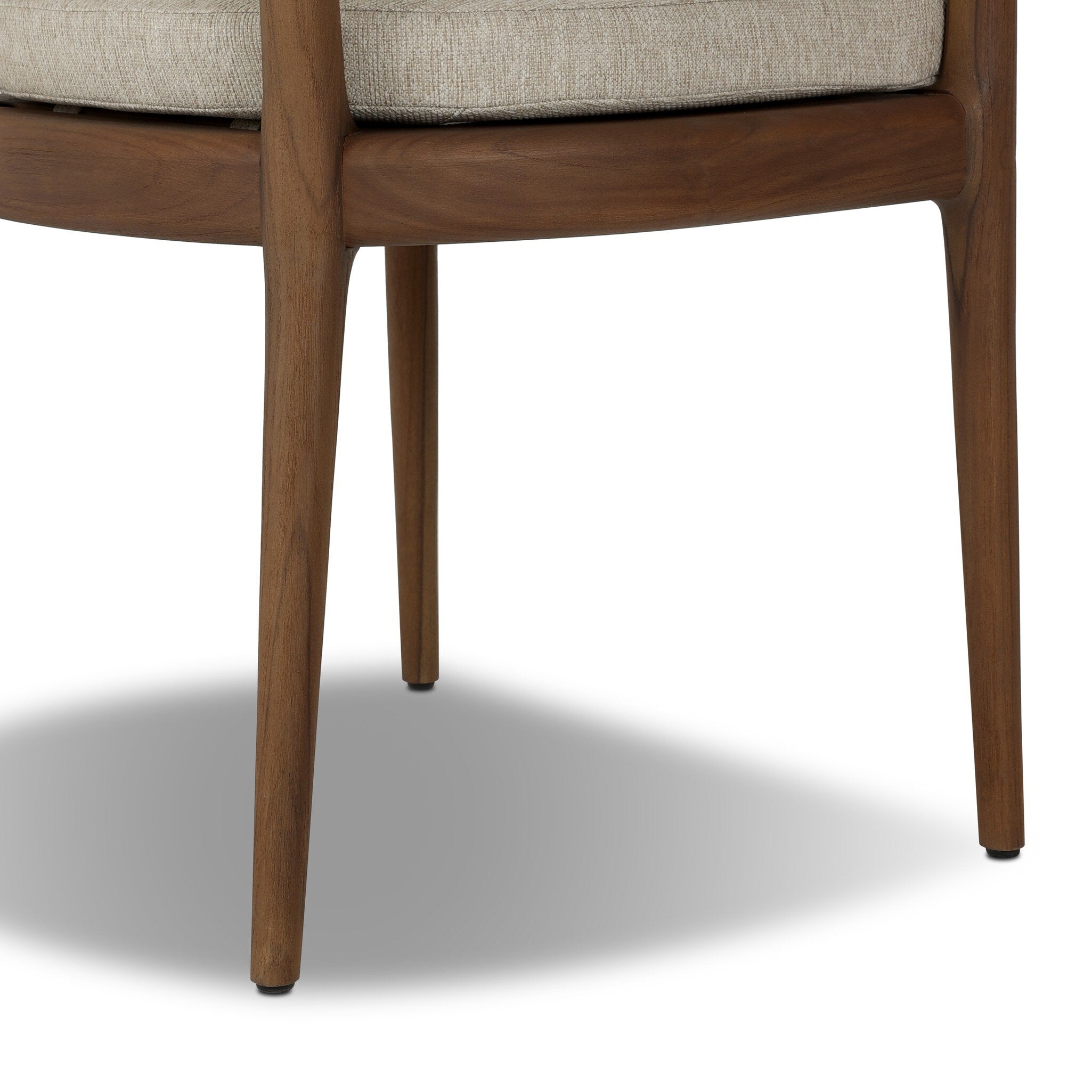 Close-up of a wooden chair with a beige cushion on a white background