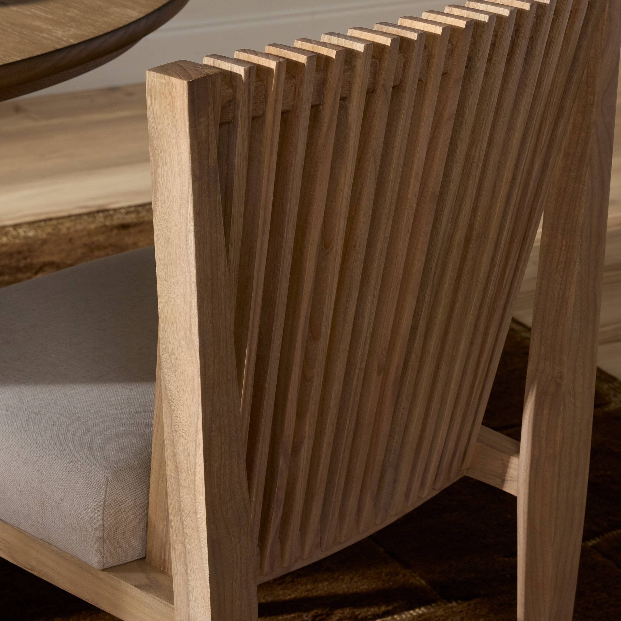 Wooden chair with a slatted backrest in a room setting