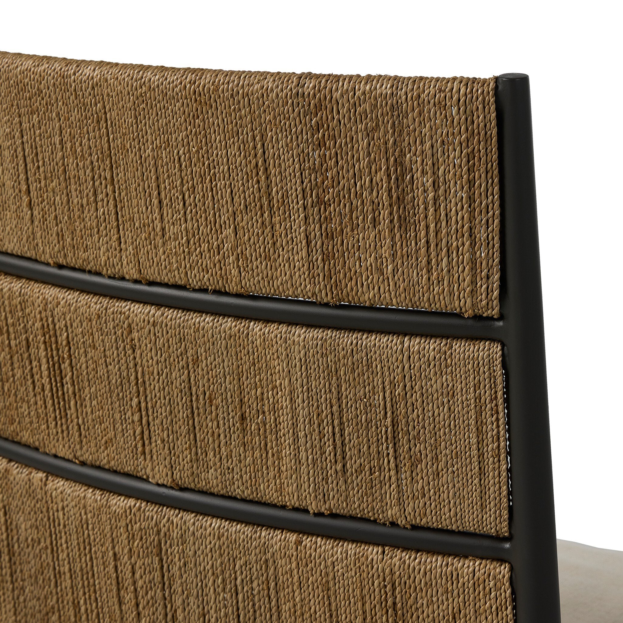 Close-up of a brown woven chair backrest with black metal frame on a white background