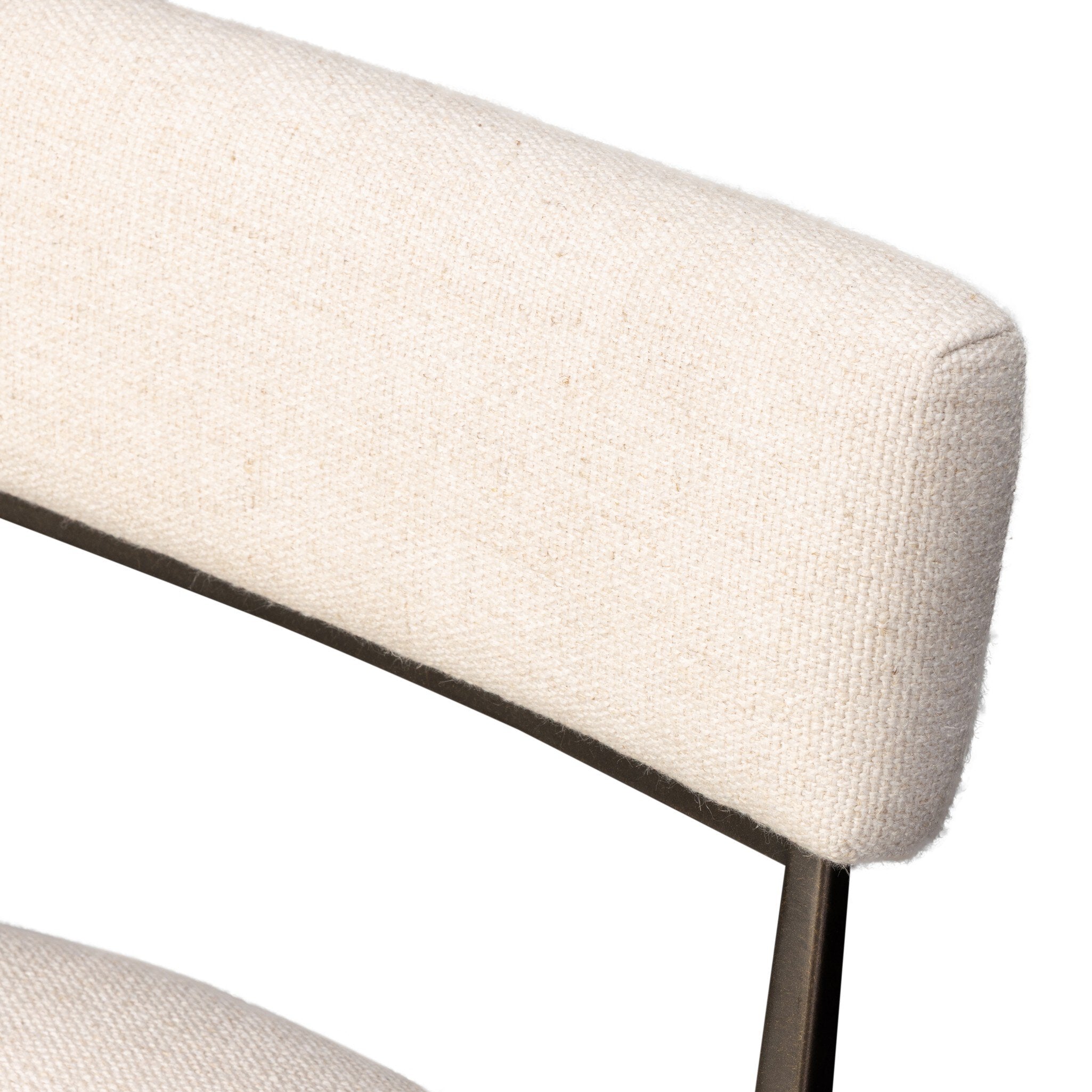 Close-up of a beige upholstered chair with a white background