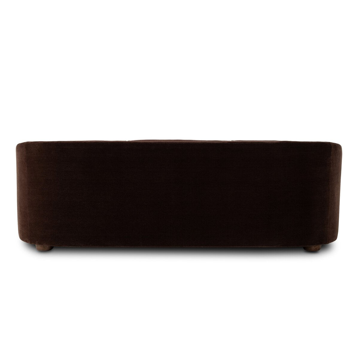 A dark brown velvet upholstered sofa with a rounded rectangular shape and small wooden feet, shown from the back on a solid white background.