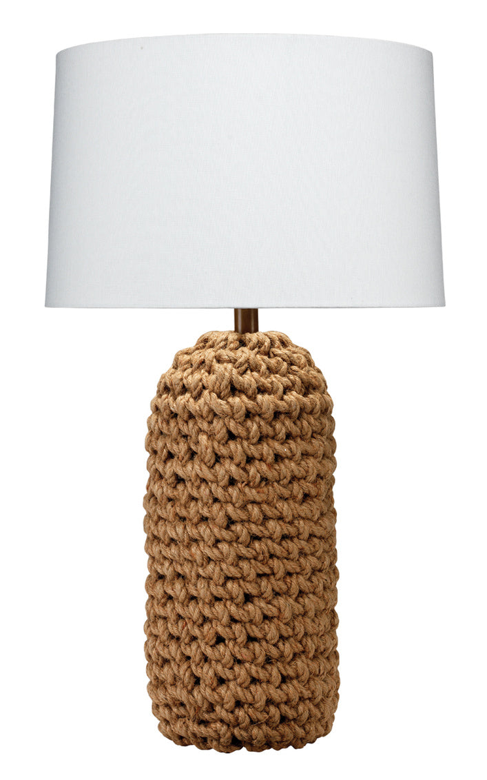 Table lamp with woven rope brown base and white shade on a white background