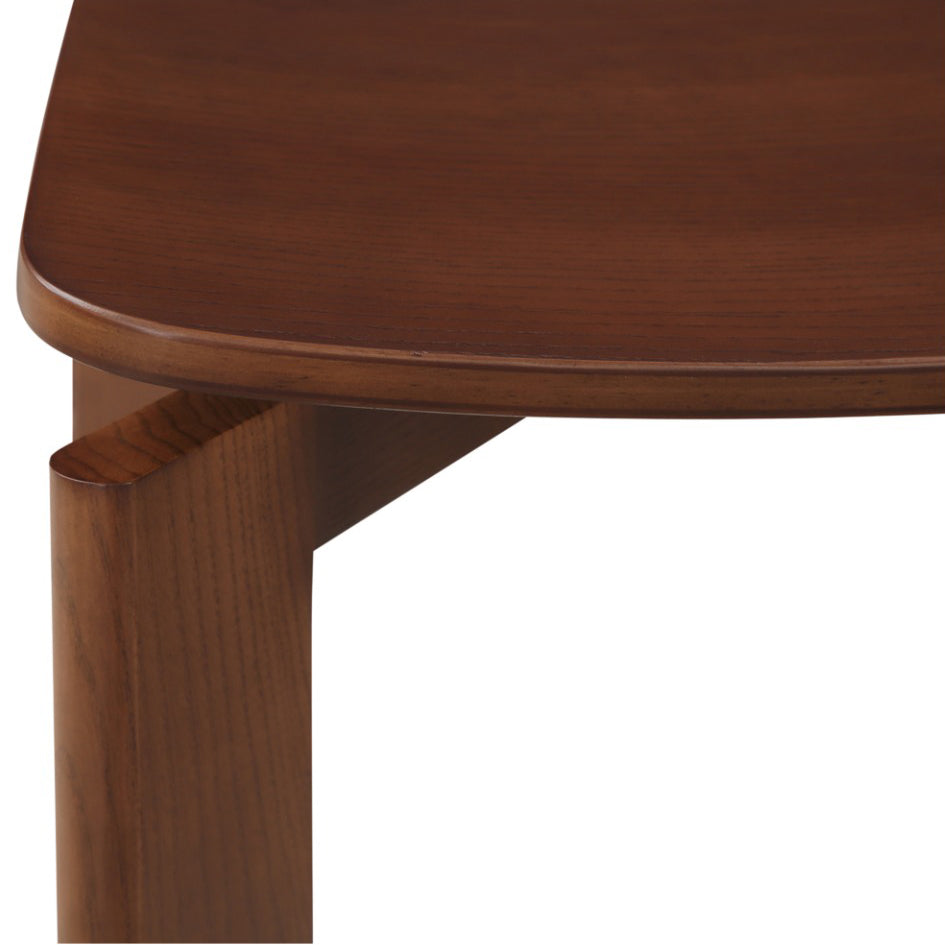 Close-up of a wooden table corner on a white background