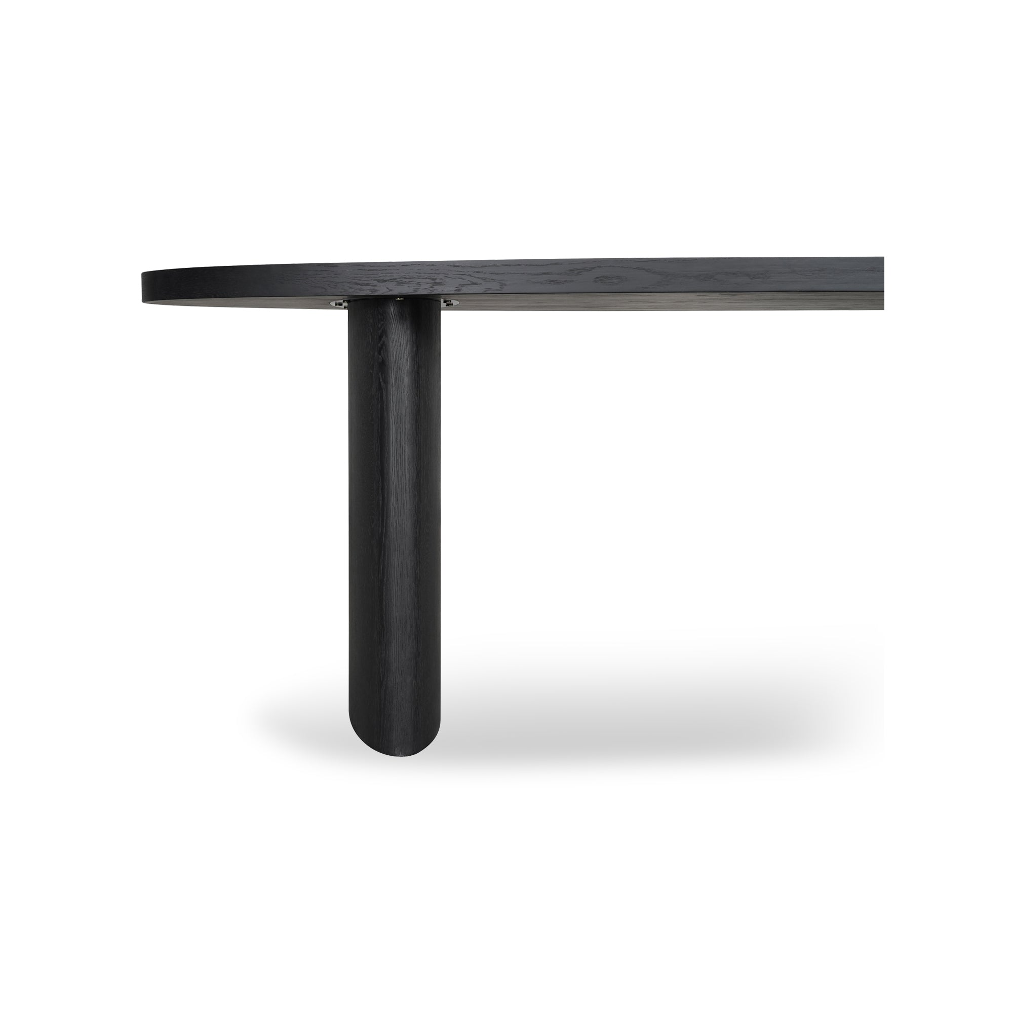 Black oval dining table with a round leg on a white background