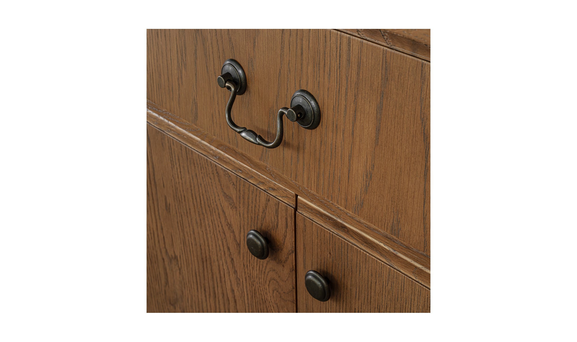 Wooden sideboard with black handles on a white background