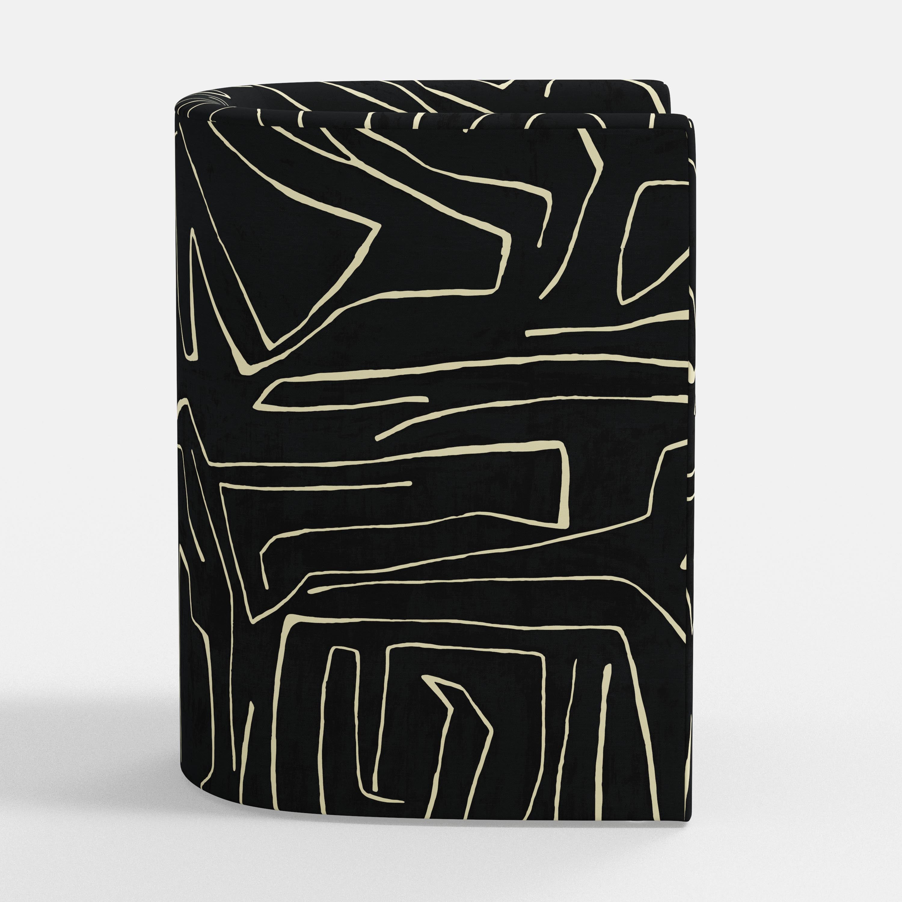 Black armchair with white abstract patterns on a white background