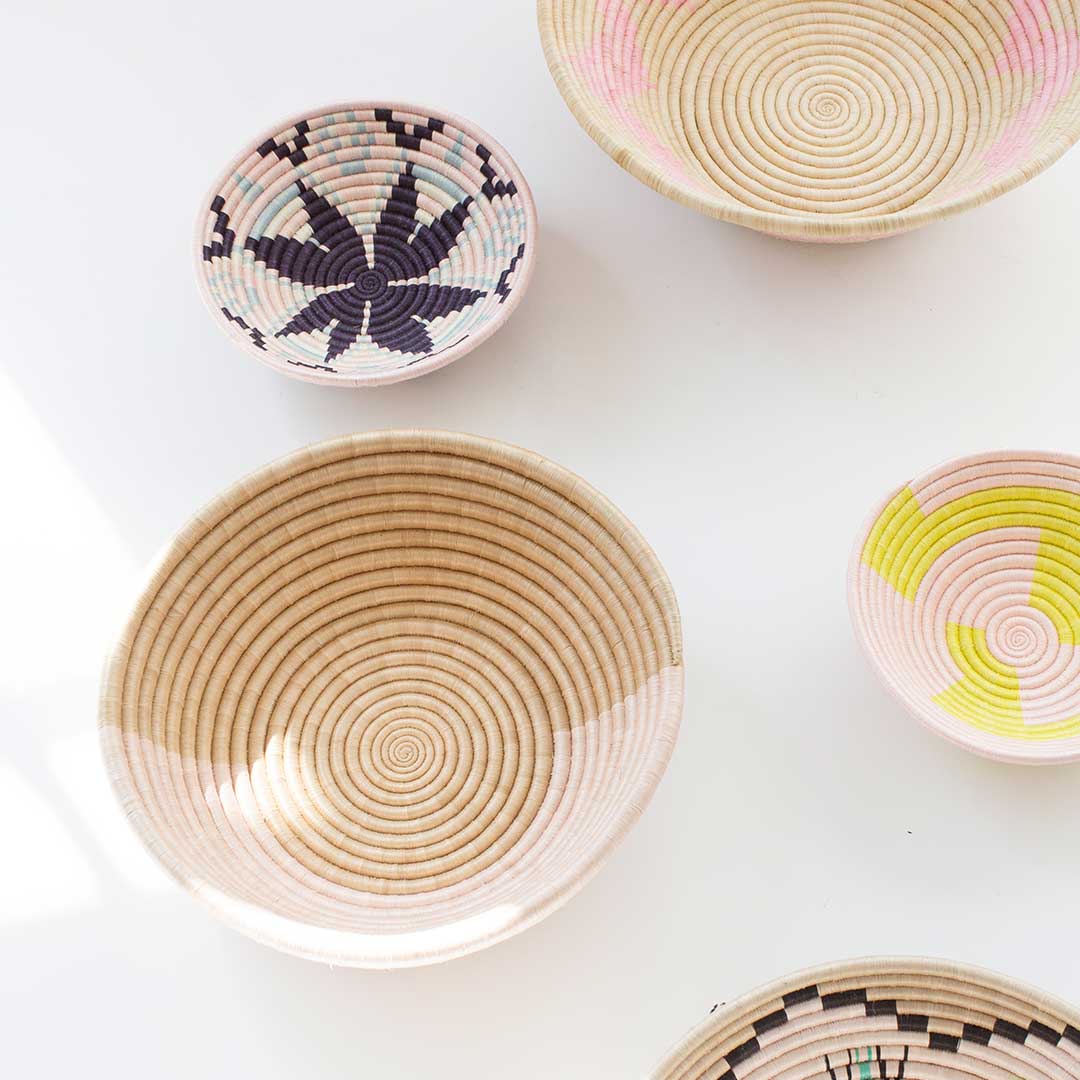 Woven baskets with circular patterns on a white background