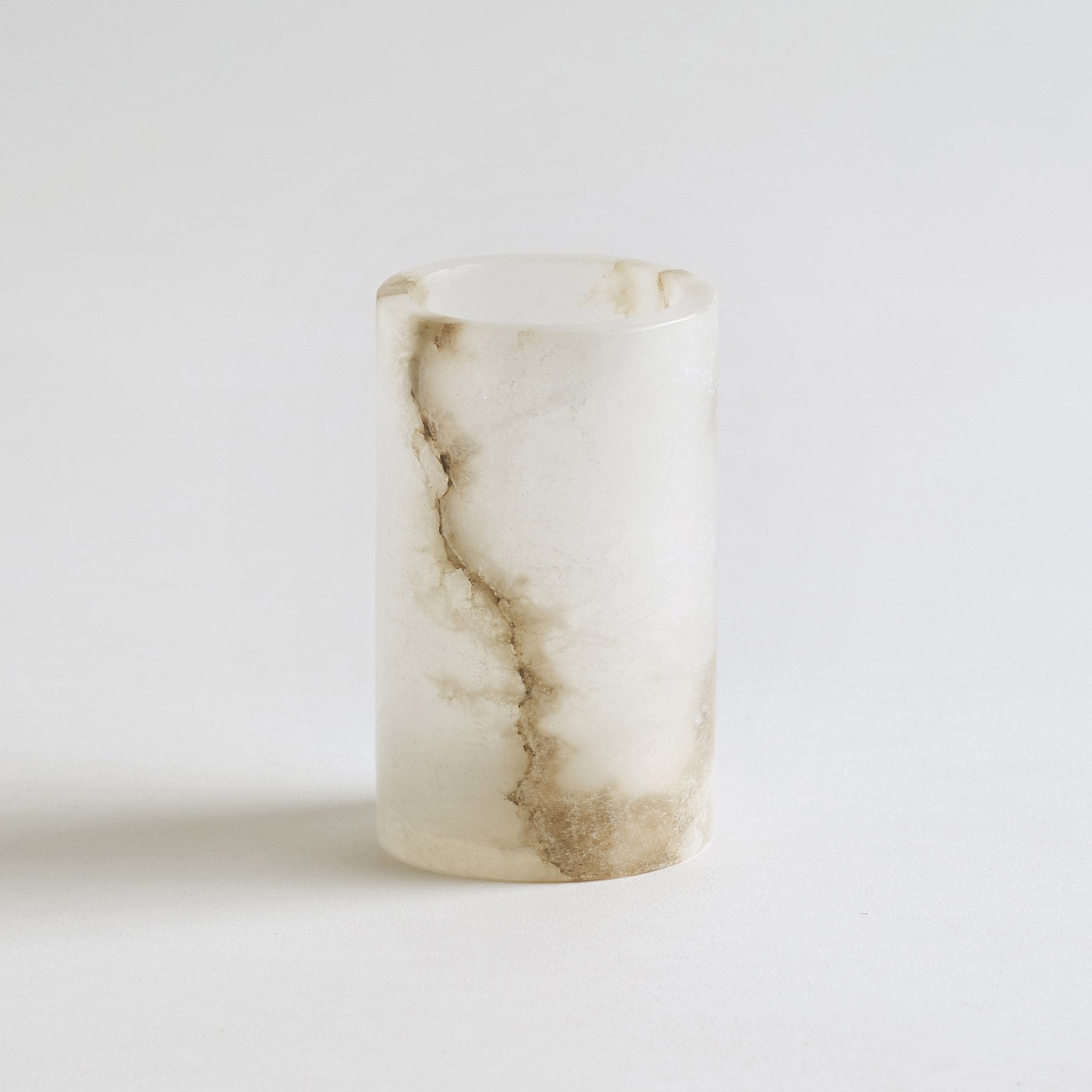 Alabaster candle holder on a light gray background