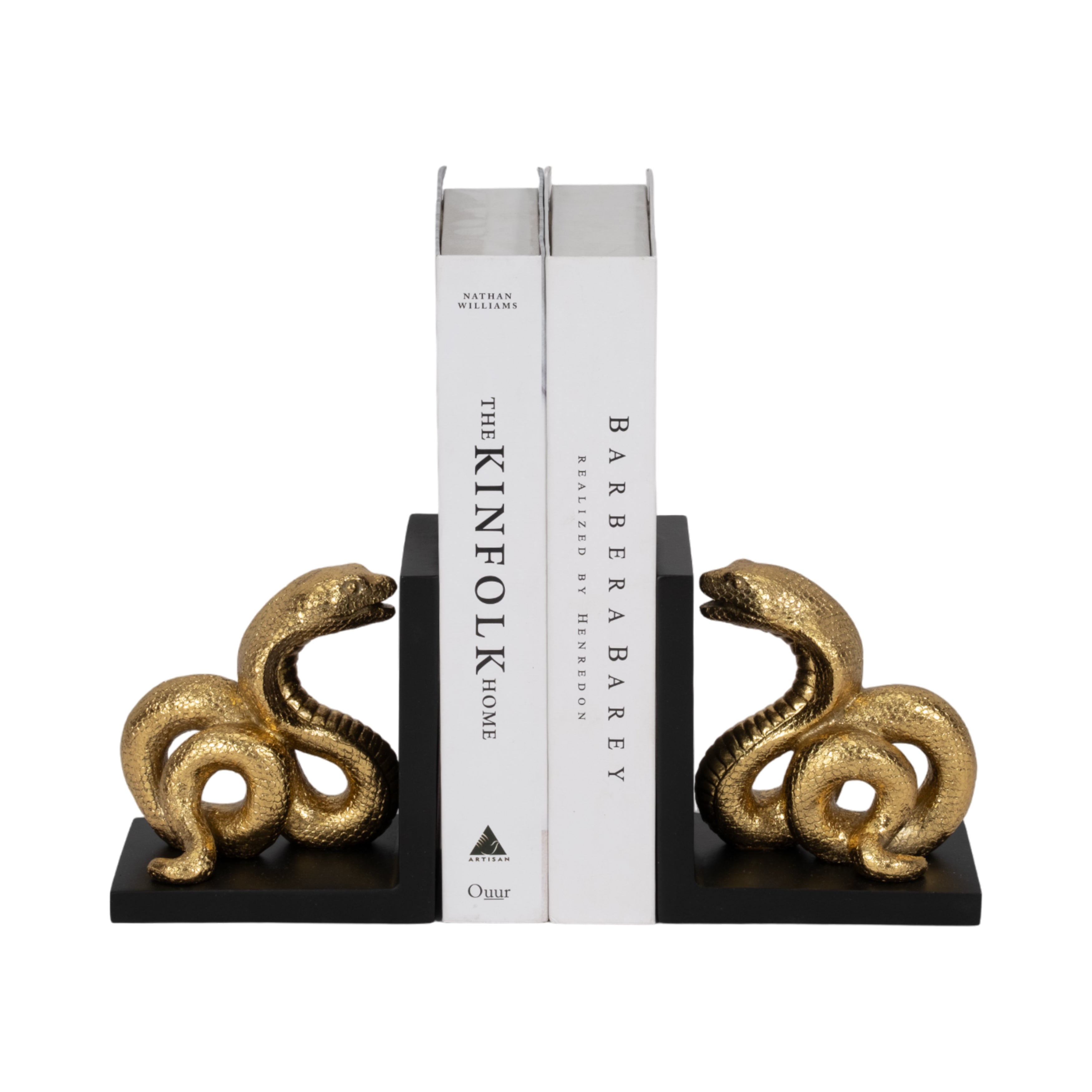 Gold snake-shaped bookends holding books on a white background