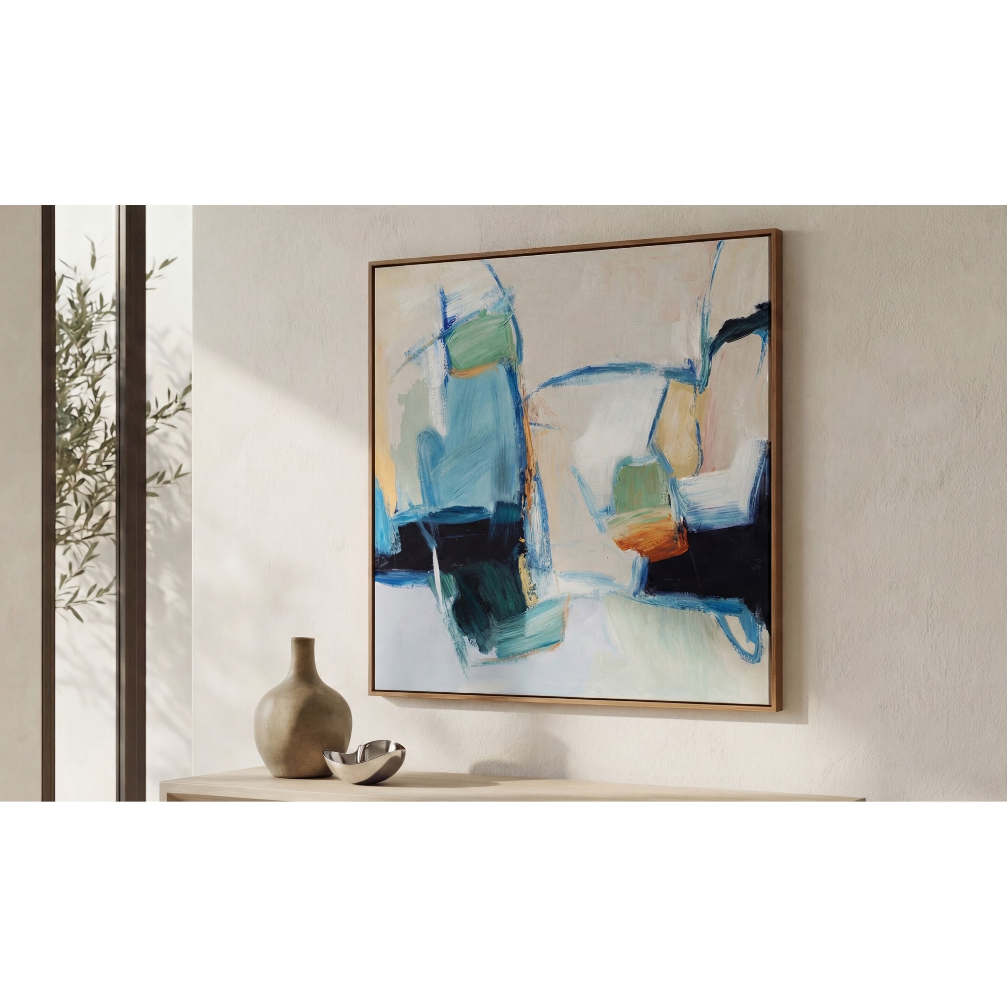 Abstract painting on a wall with decorative items below