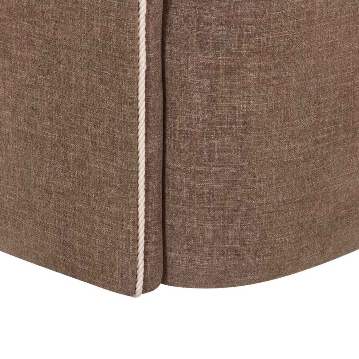 Close-up of a brown fabric corner with a white seam on a white background