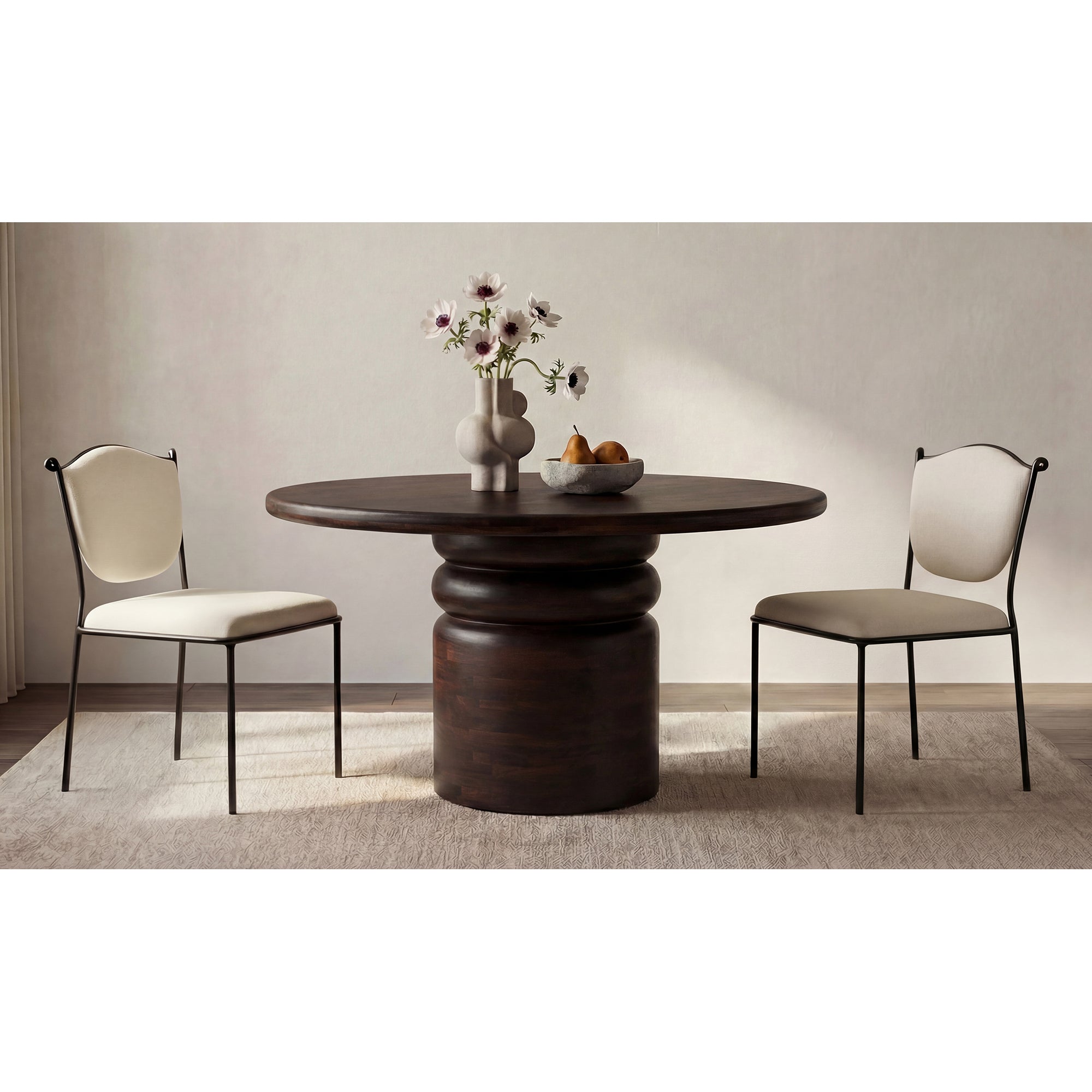 Dining table with two chairs in a room setting