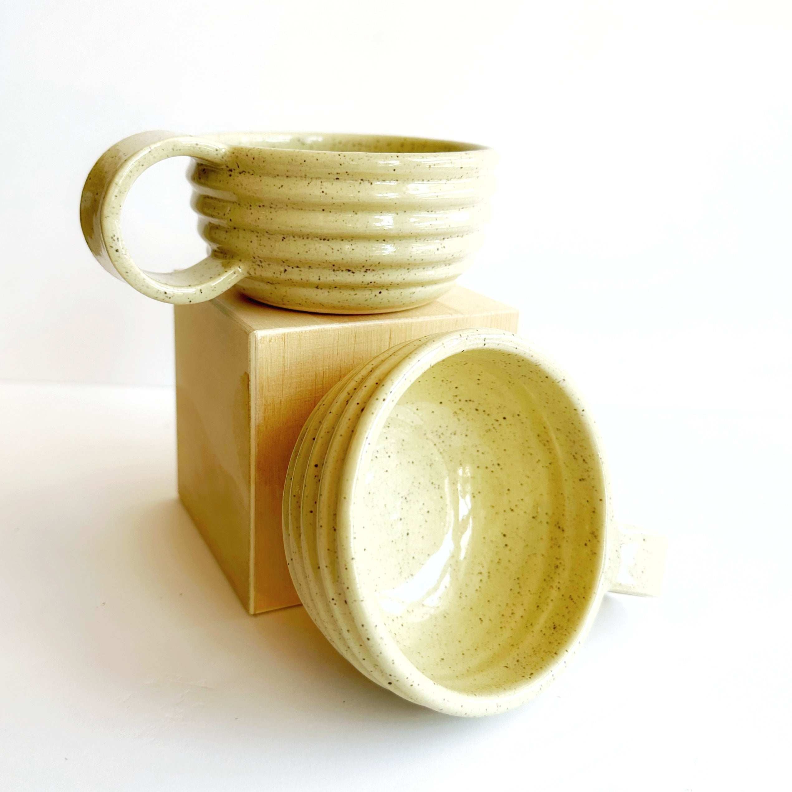 Two ceramic mugs on a white background
