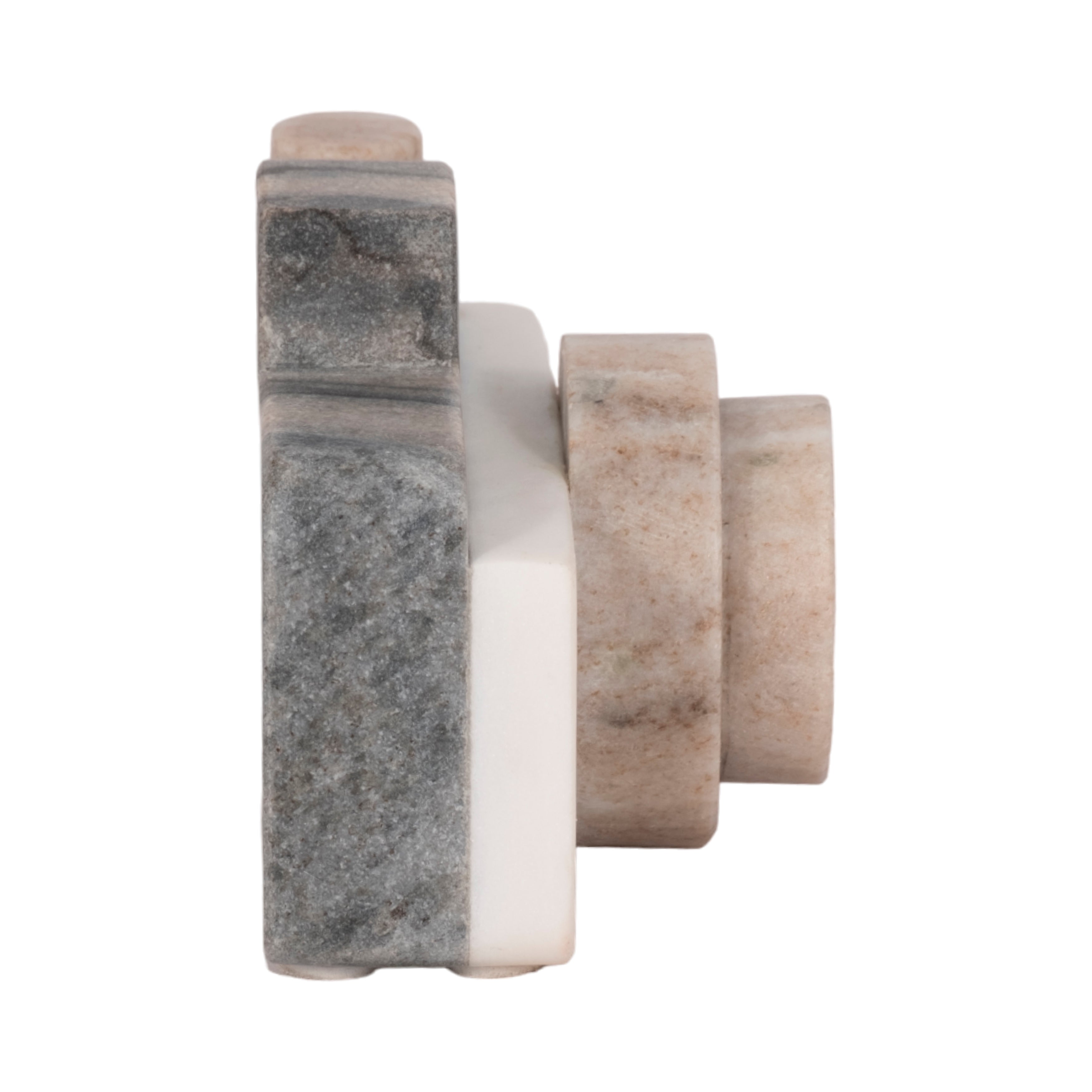 Three cylindrical marble objects with different gray tones on a white background