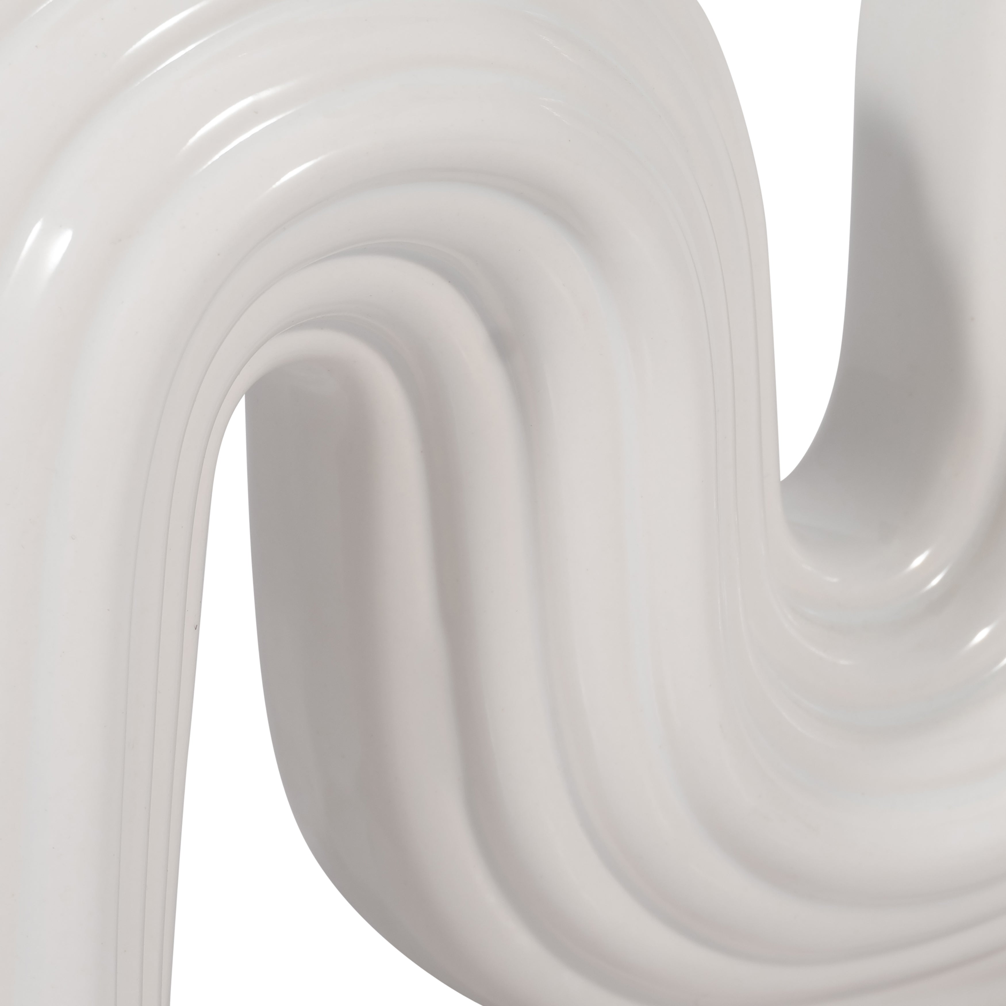 Close-up of white, glossy, wavy surface