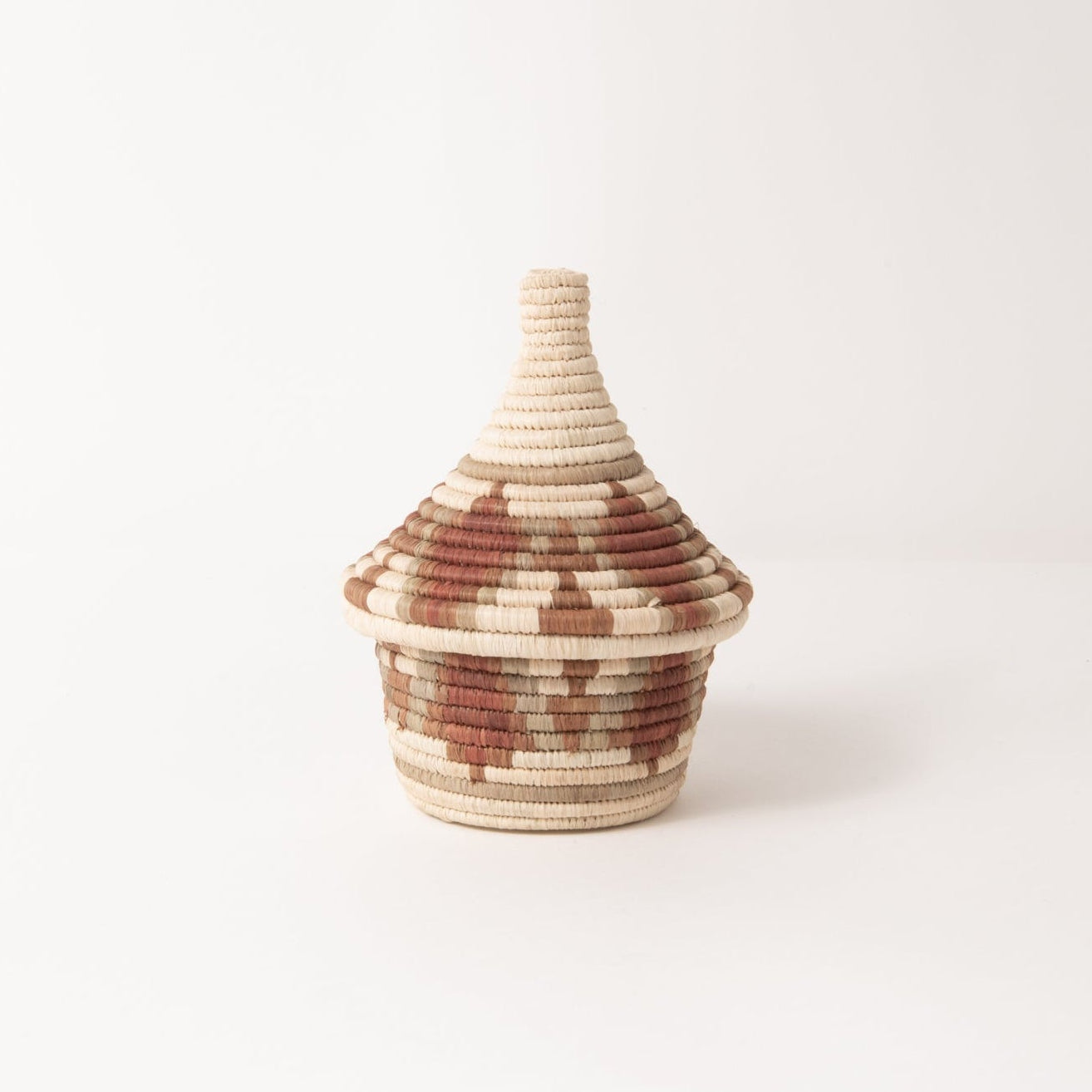 Small woven vase with a textured design on a white background