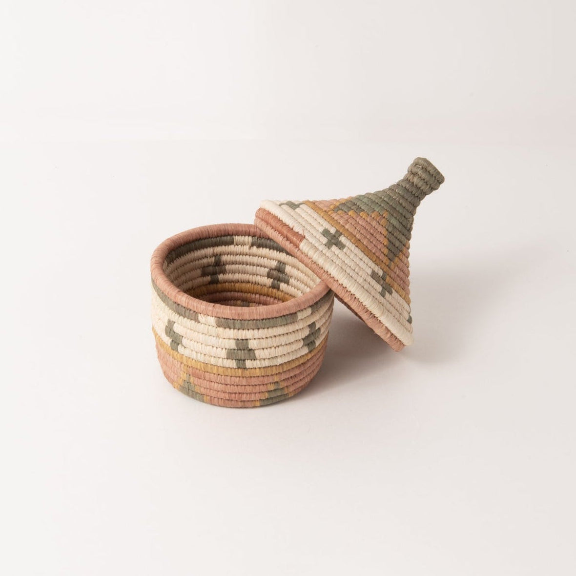 Woven basket with a lid on a white background