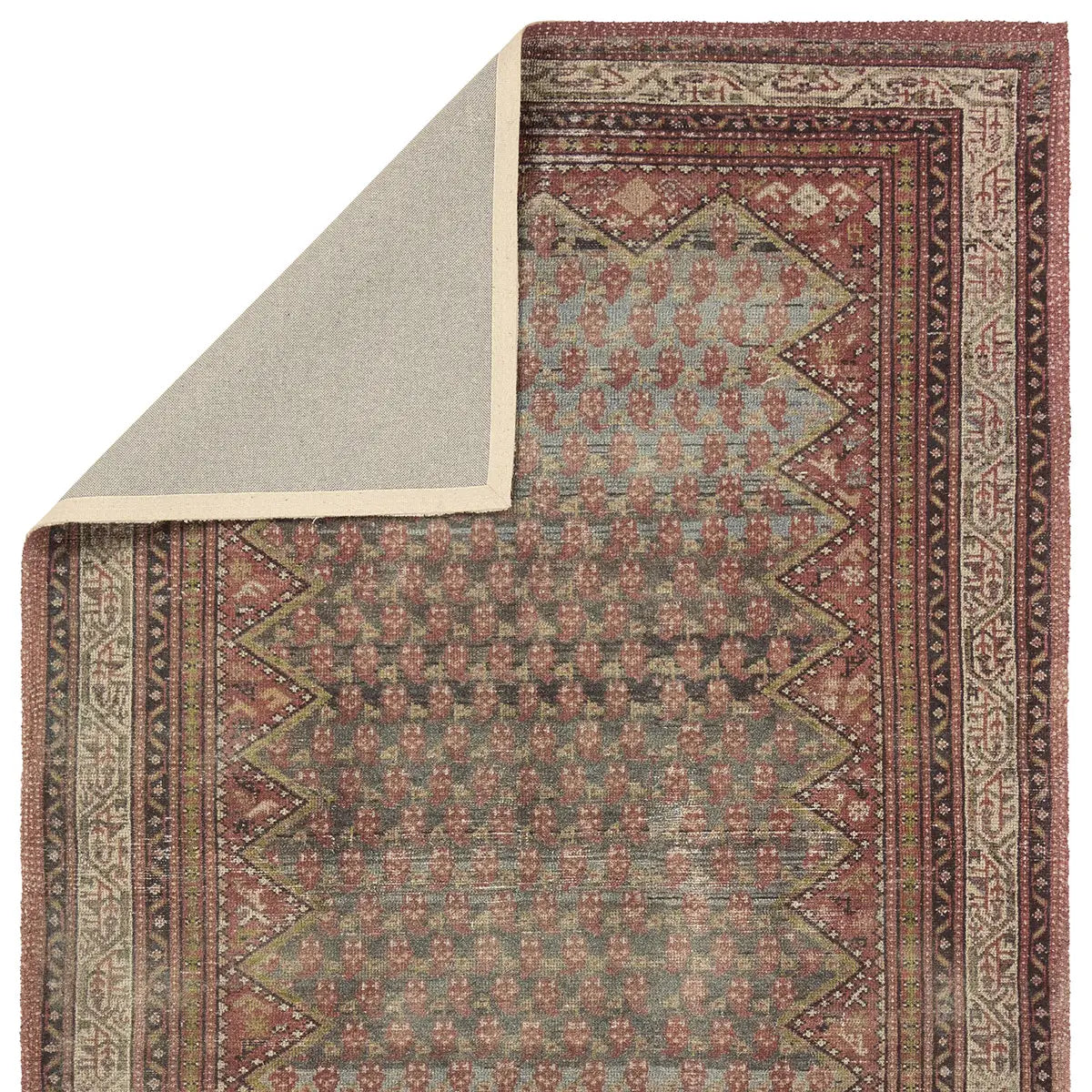 Patterned rug with geometric design on a beige background