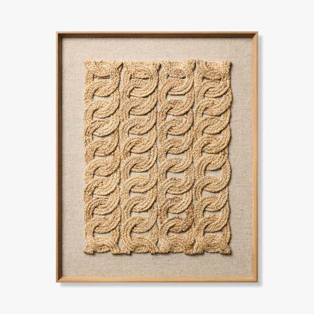 Framed woven art piece on a plain background