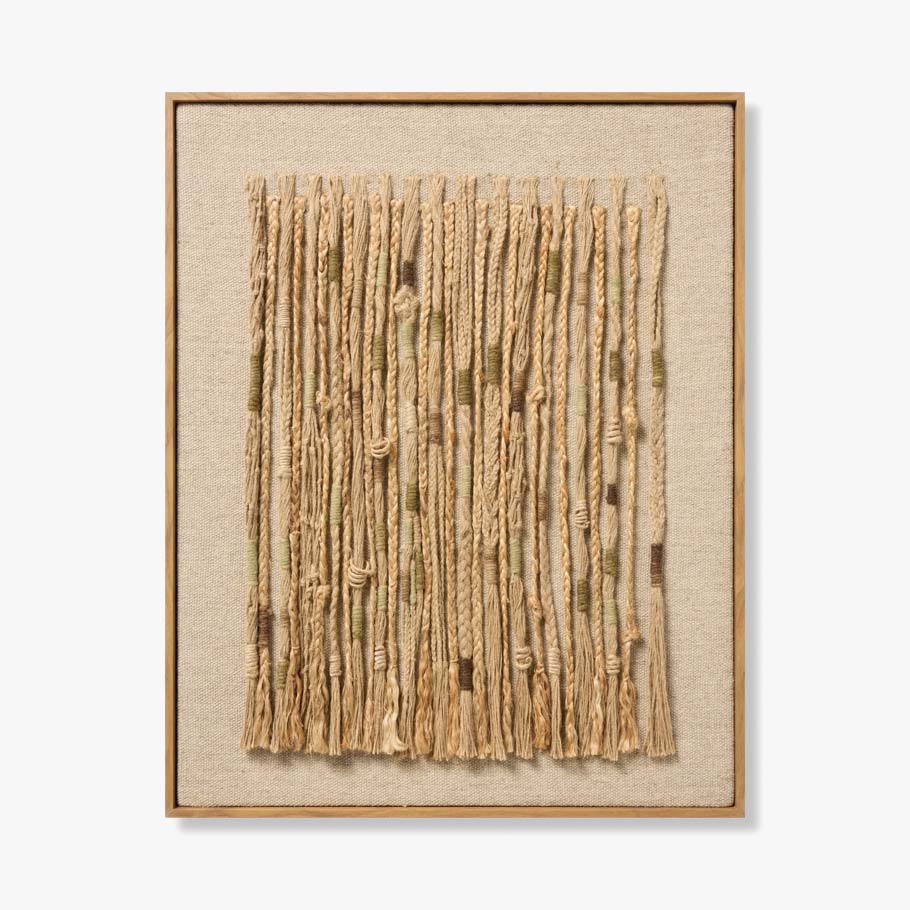Framed woven art piece on a beige background