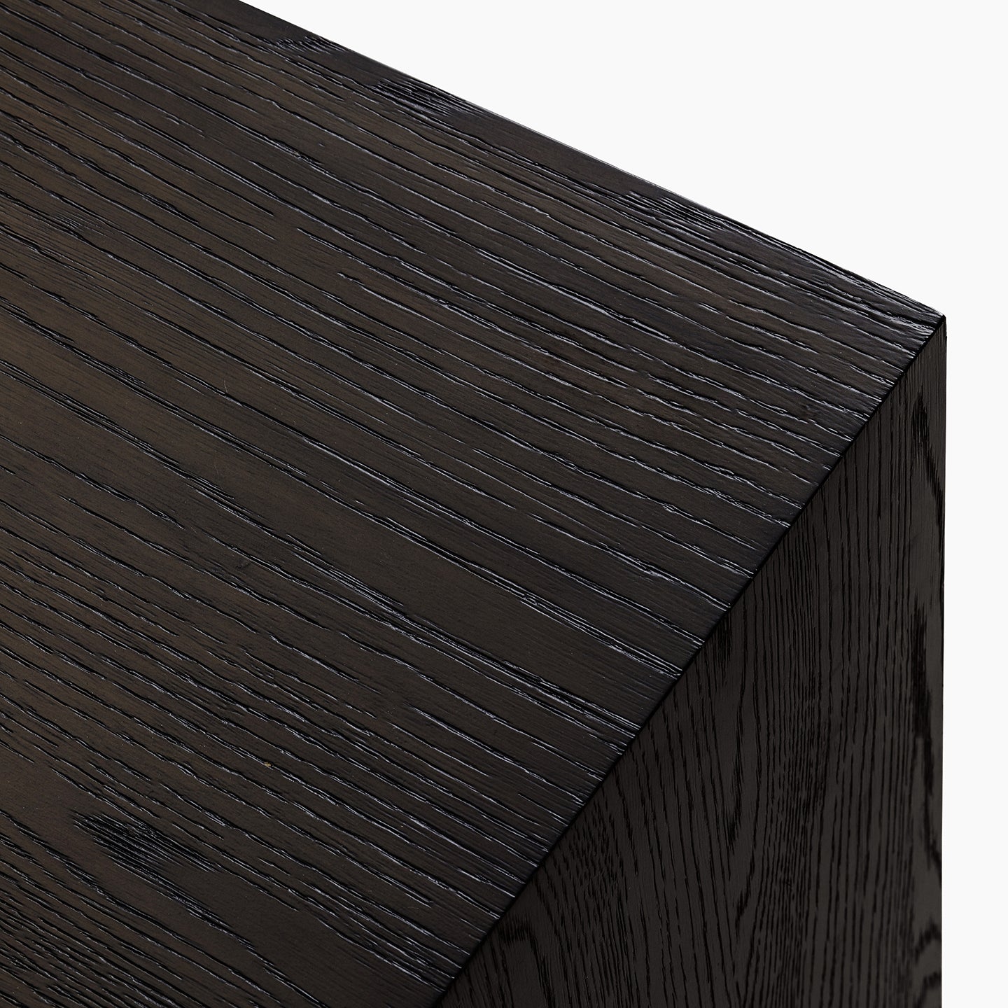Close-up of a dark wooden surface with visible grain texture.