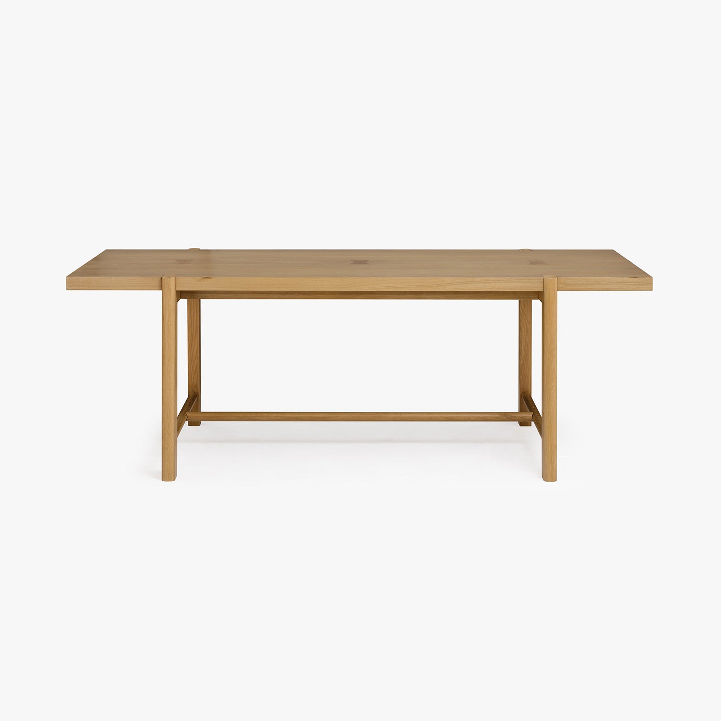Wooden dining table on a white background
