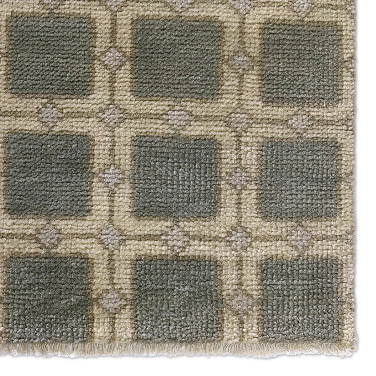 Close-up of a textured rug with a geometric pattern