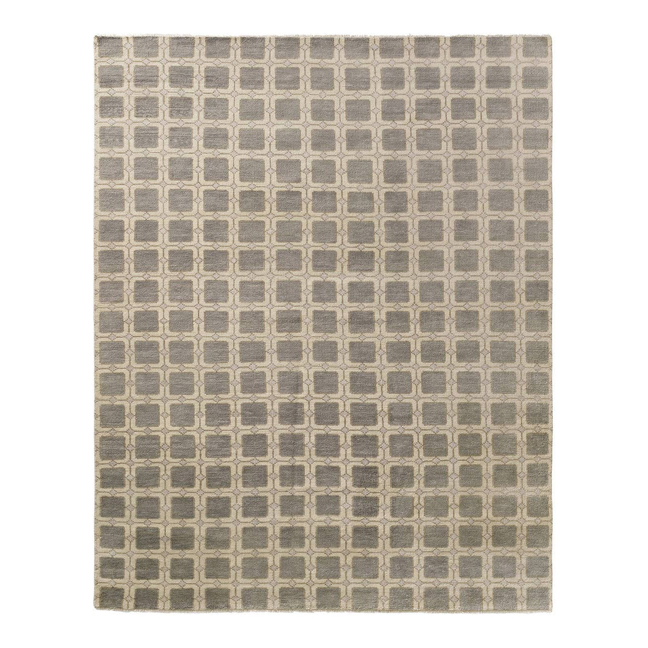 Patterned rug with geometric design on a plain background