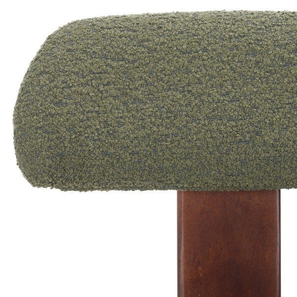 Chair with green cushioned seat and backrest on a white background