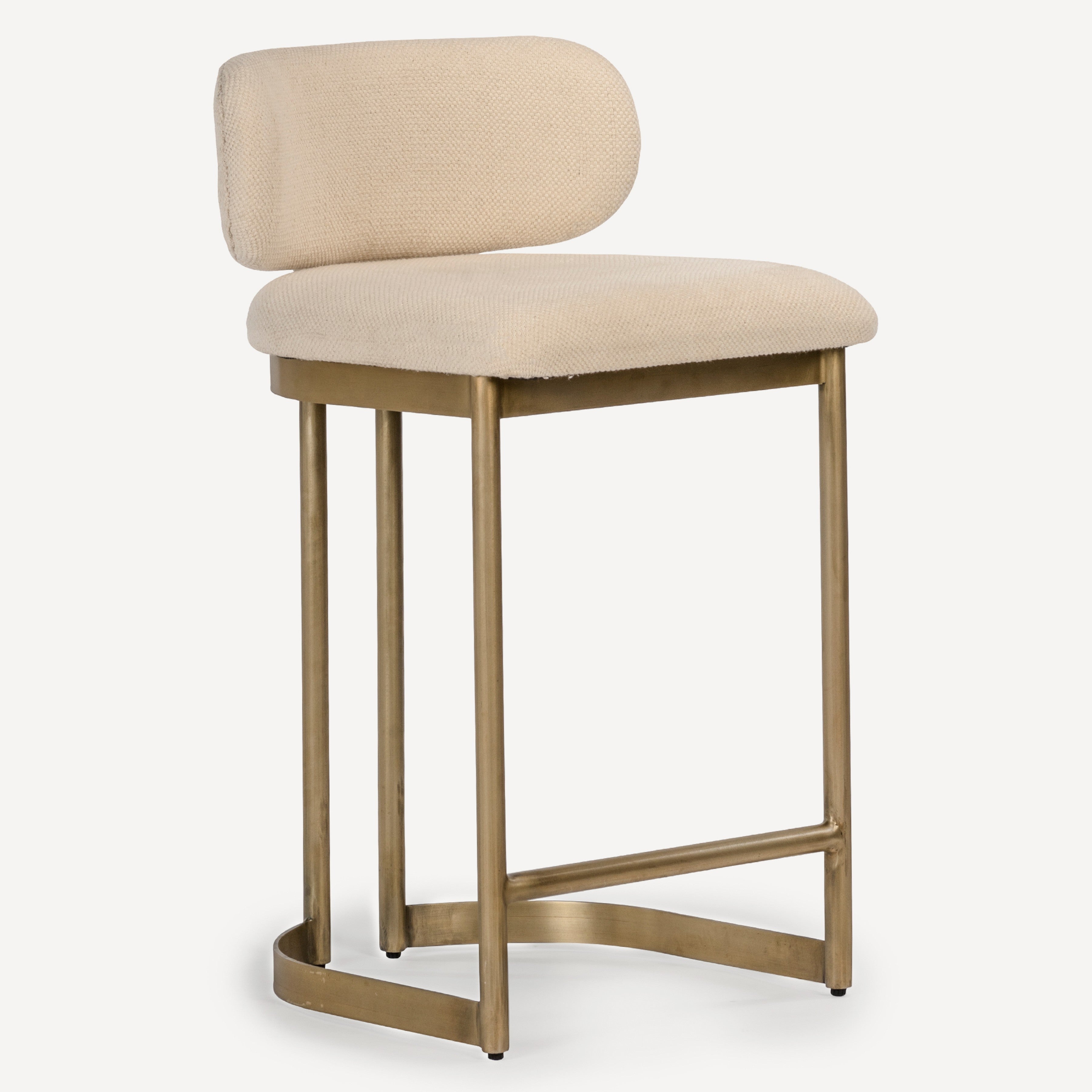A modern bar stool with a textured beige upholstered seat and curved backrest, supported by a brushed gold metal frame with a footrest.