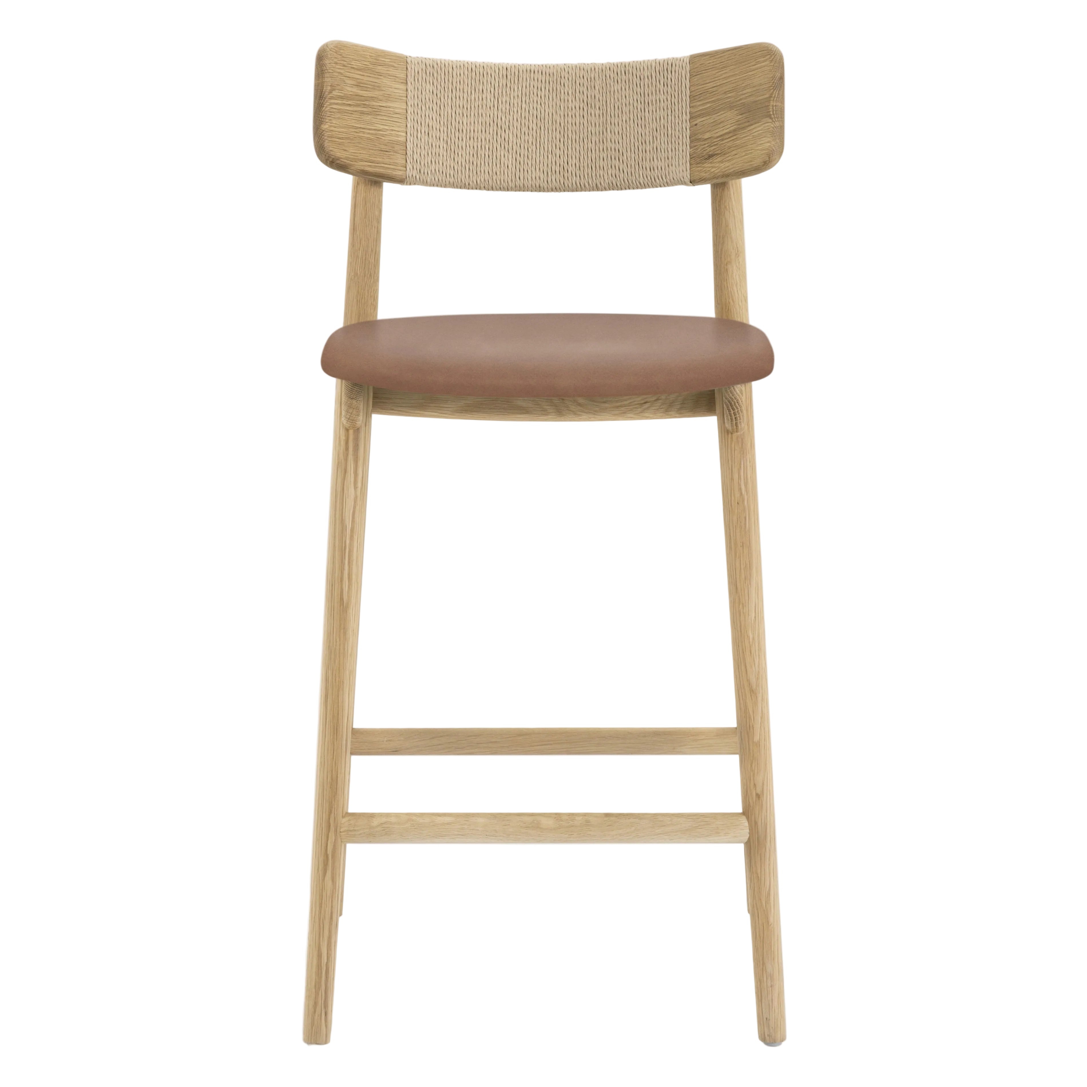 A modern wooden bar stool with a natural oak frame, a woven cane backrest, and a brown upholstered seat cushion, shown against a plain light gray background.