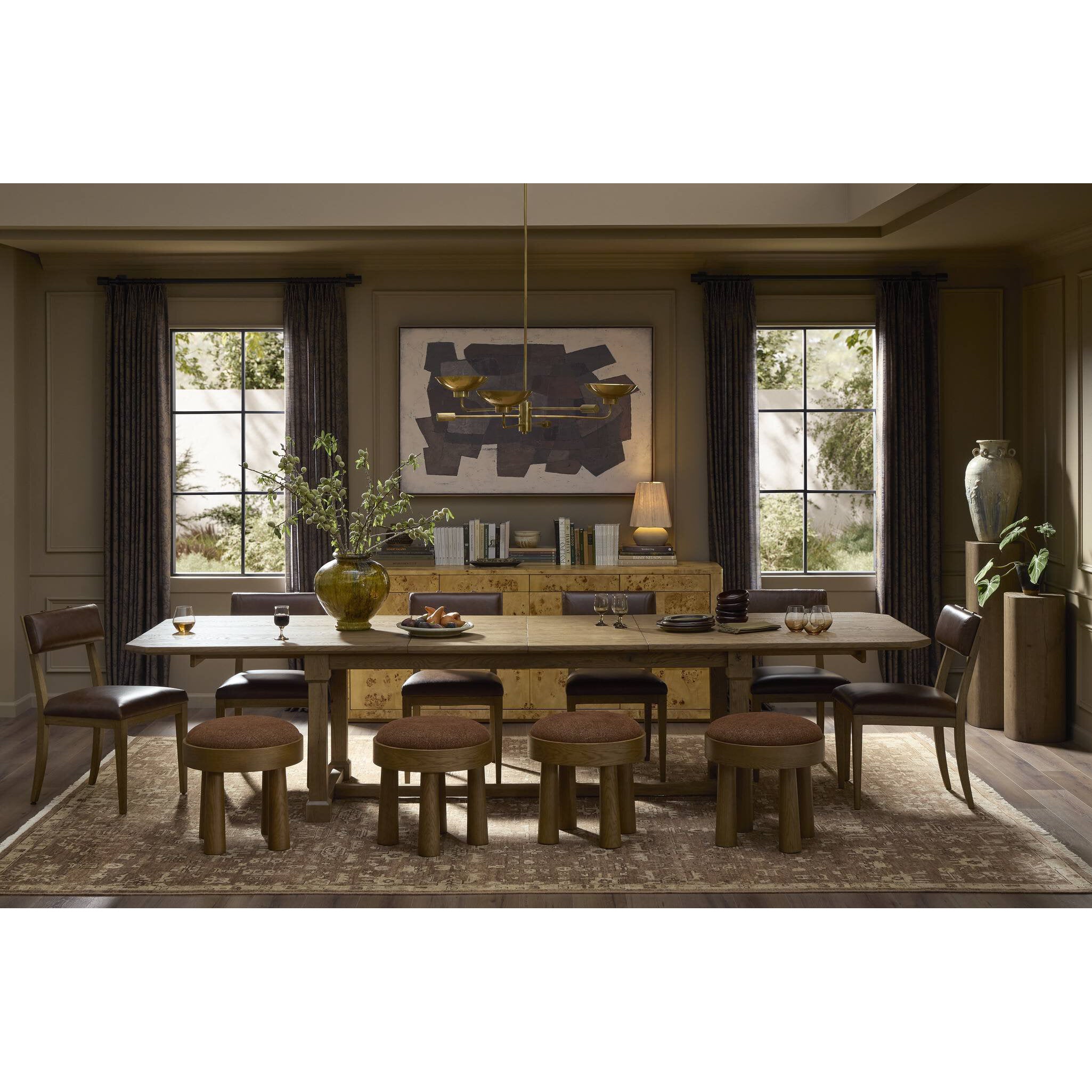 Dining room with wooden table and chairs in a well-lit room.