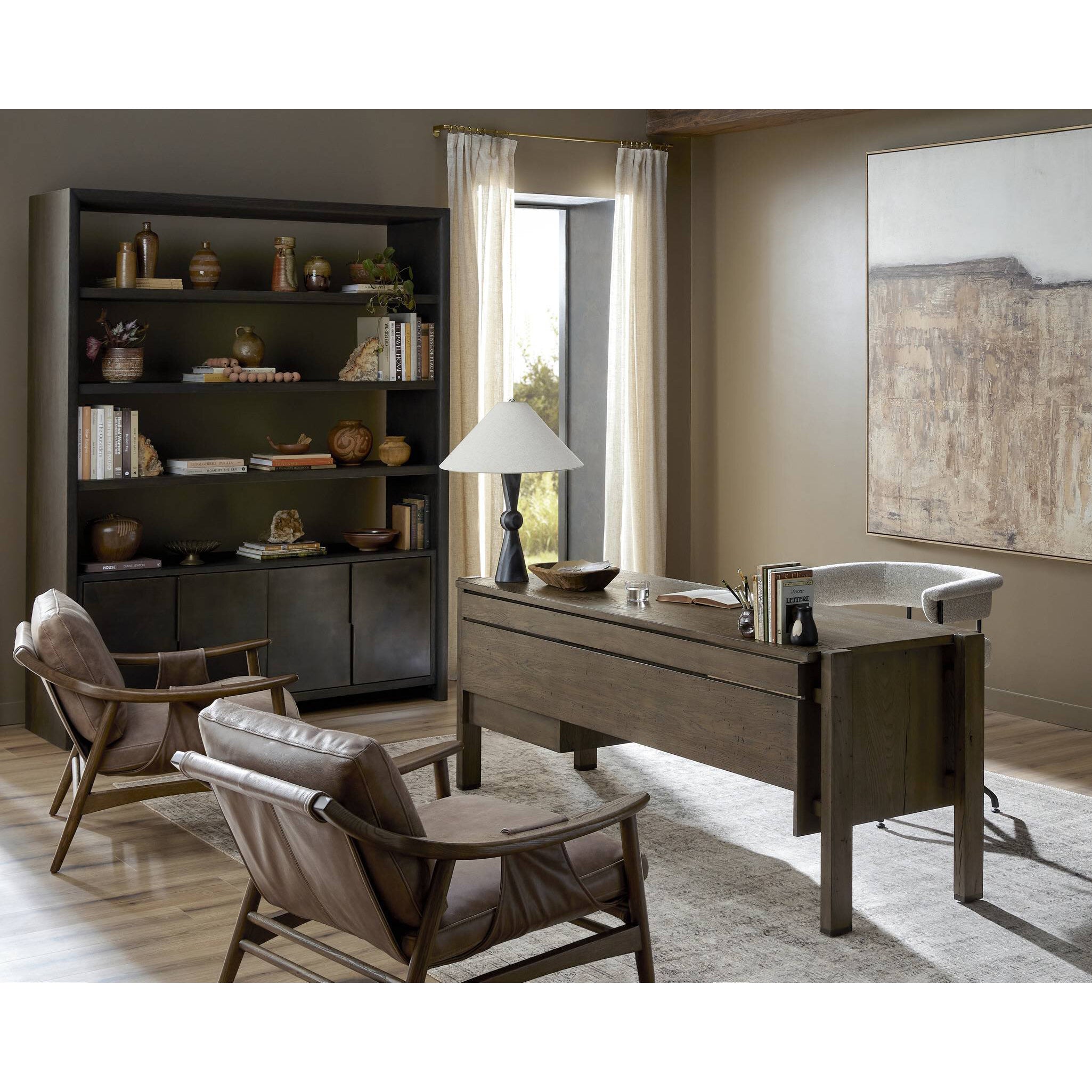 Modern office with wooden desk, chairs, and bookshelf.