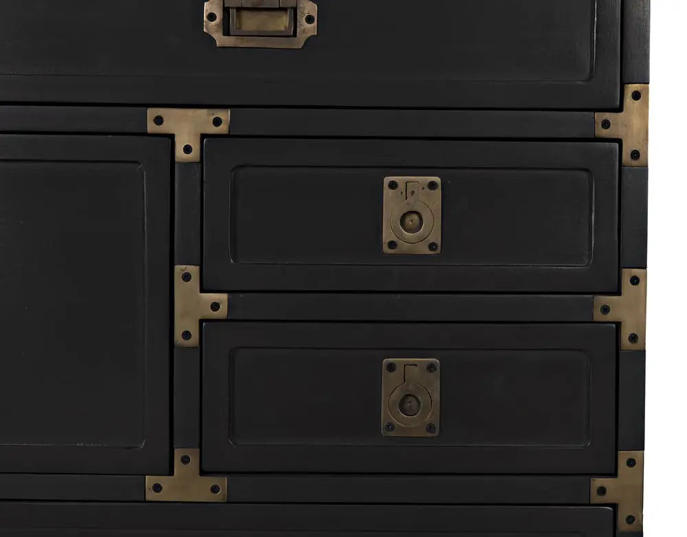 Black metal chest with brass hardware on a white background