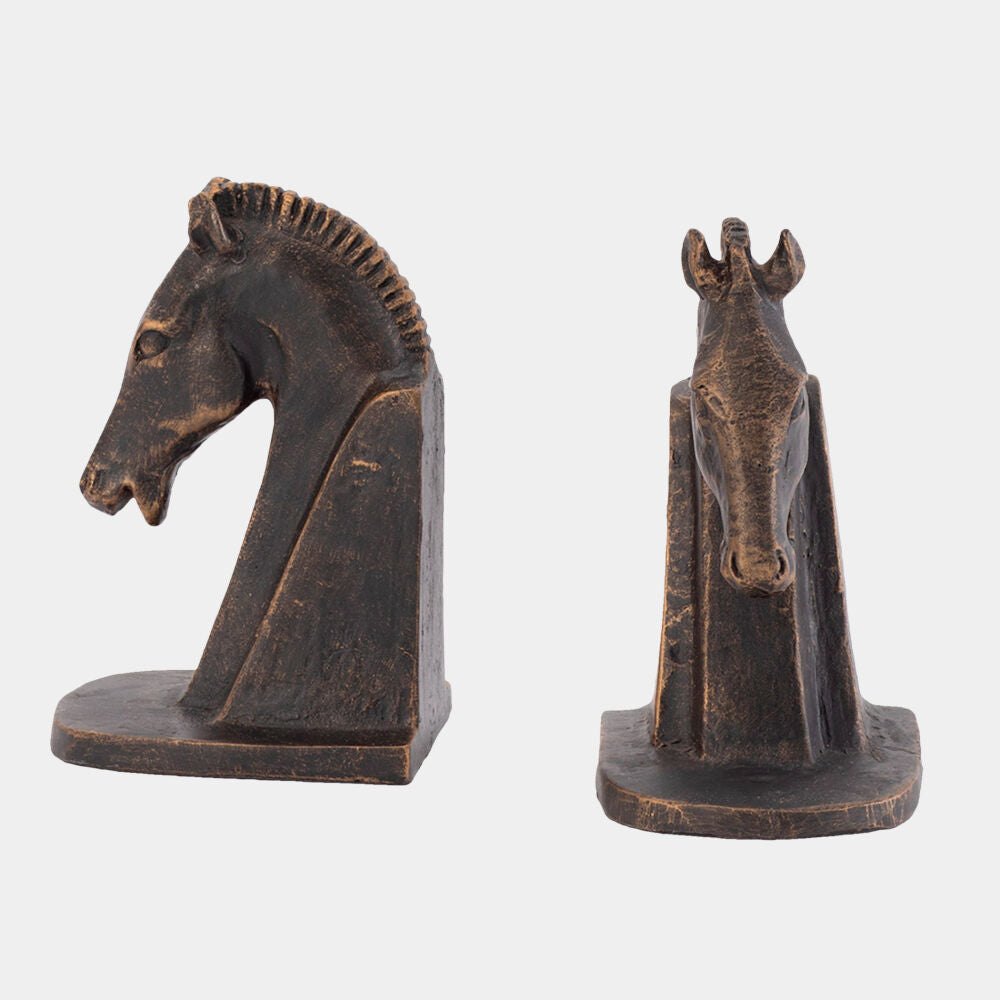 Two bronze horse head bookends on a white background