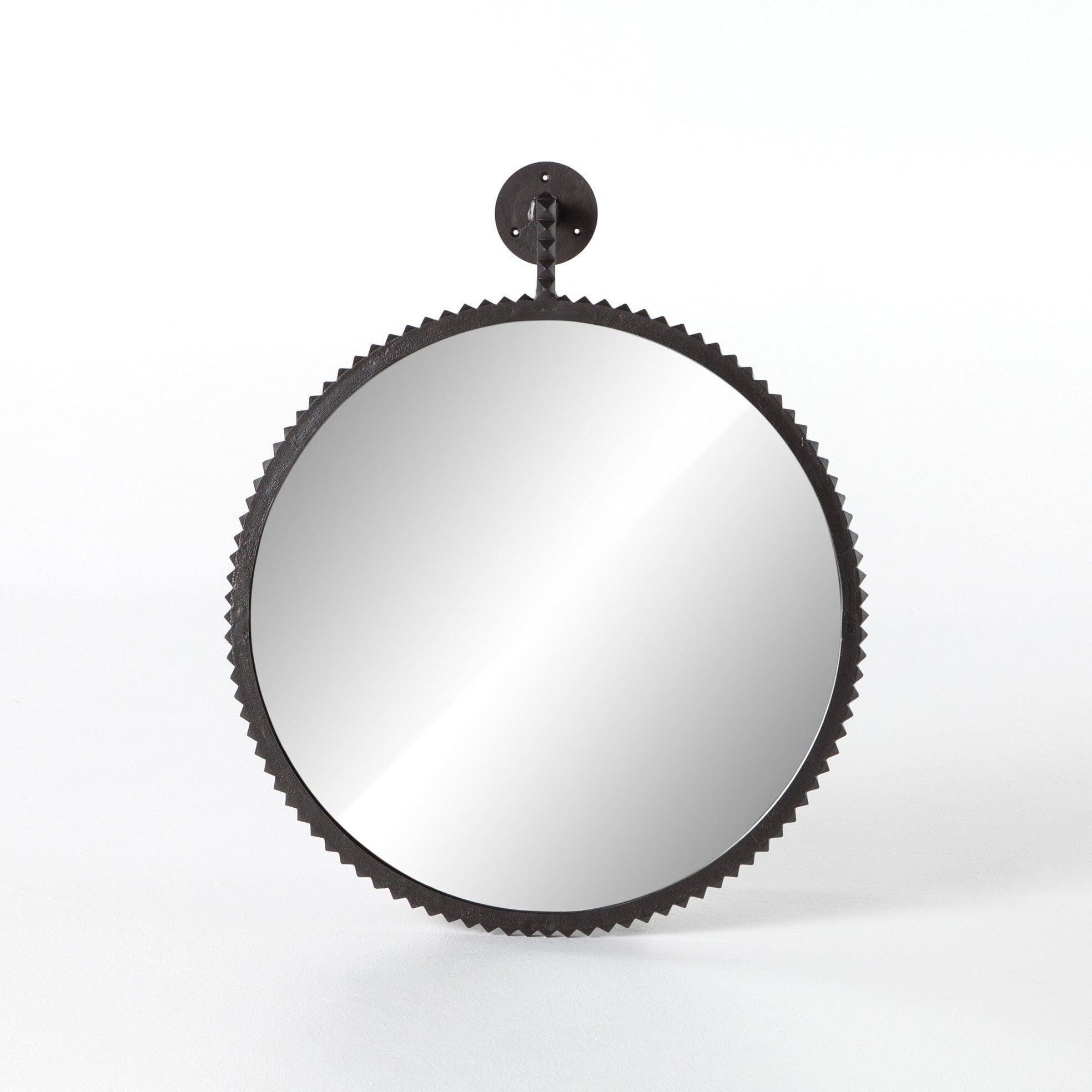 Round mirror with black metal frame on a white background