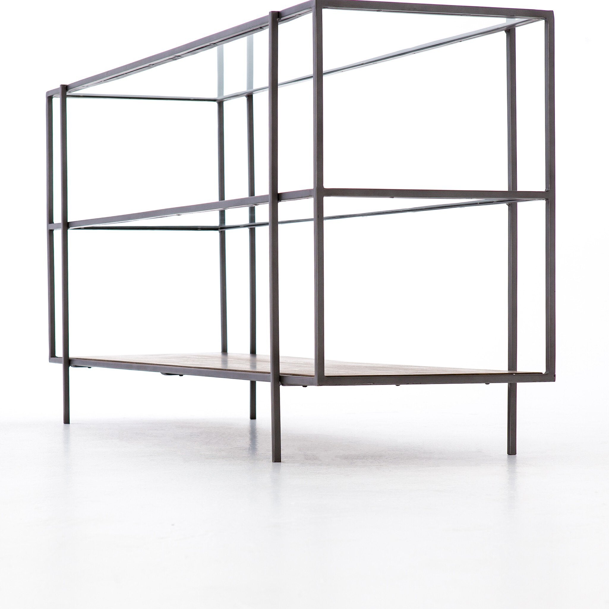 Metal shelving unit with glass panels on a white background