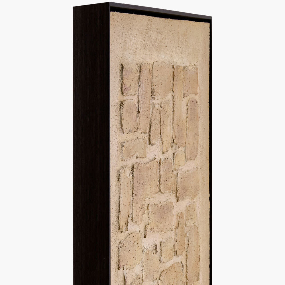 Tall vertical stone wall with a black frame on a white background