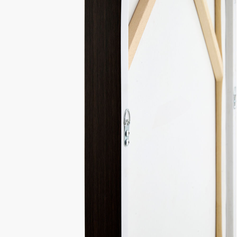 Close-up of a door with a black frame and white panel, featuring a silver handle.