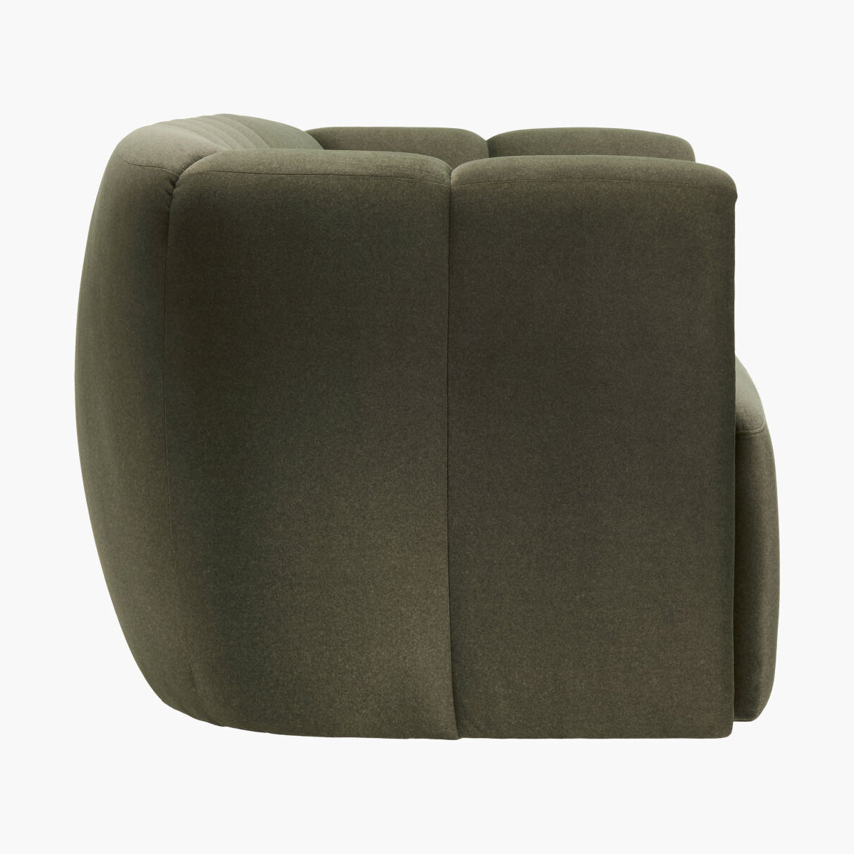 An olive green modular armchair with a rounded, blocky design, shown from a side angle against a plain white background.
