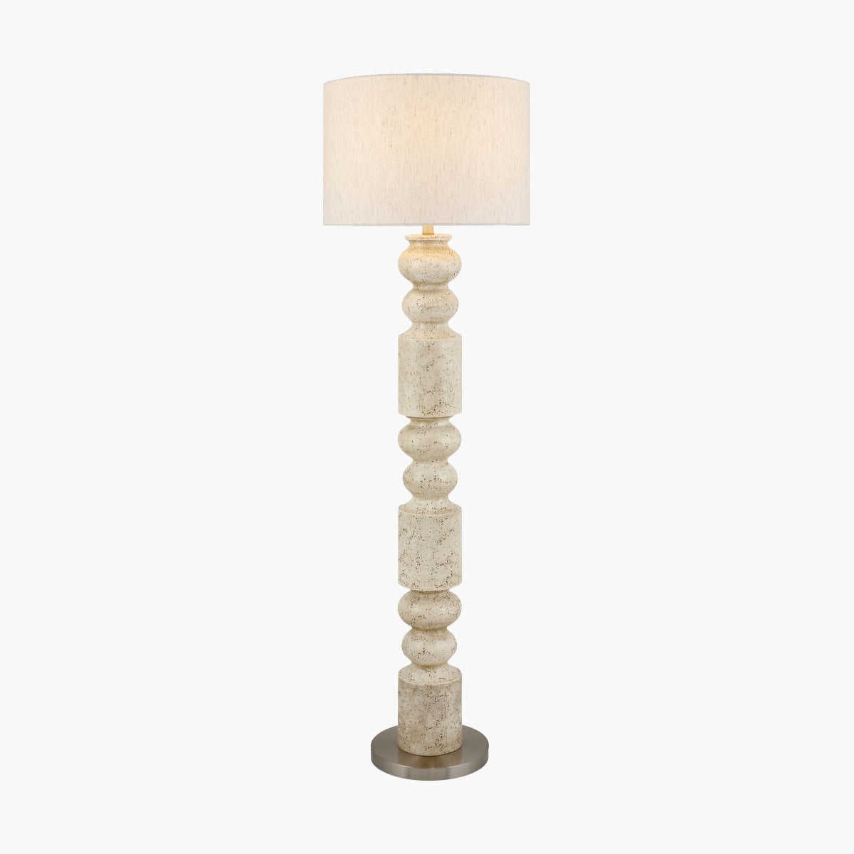 A tall floor lamp with a textured, distressed off-white stone column base and a matching fabric drum shade, shown against a plain white background.