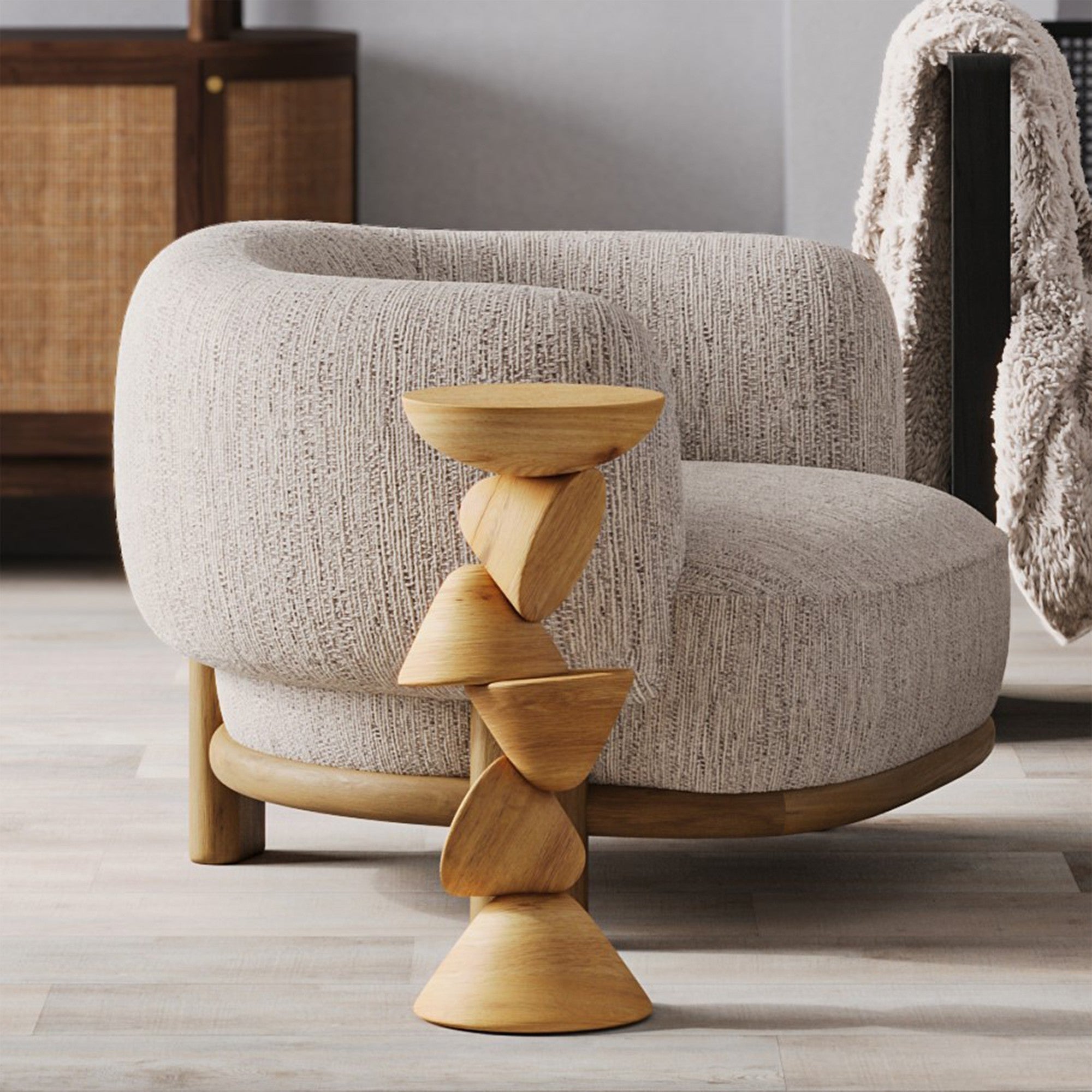 Wooden side table with a textured armchair in a room setting