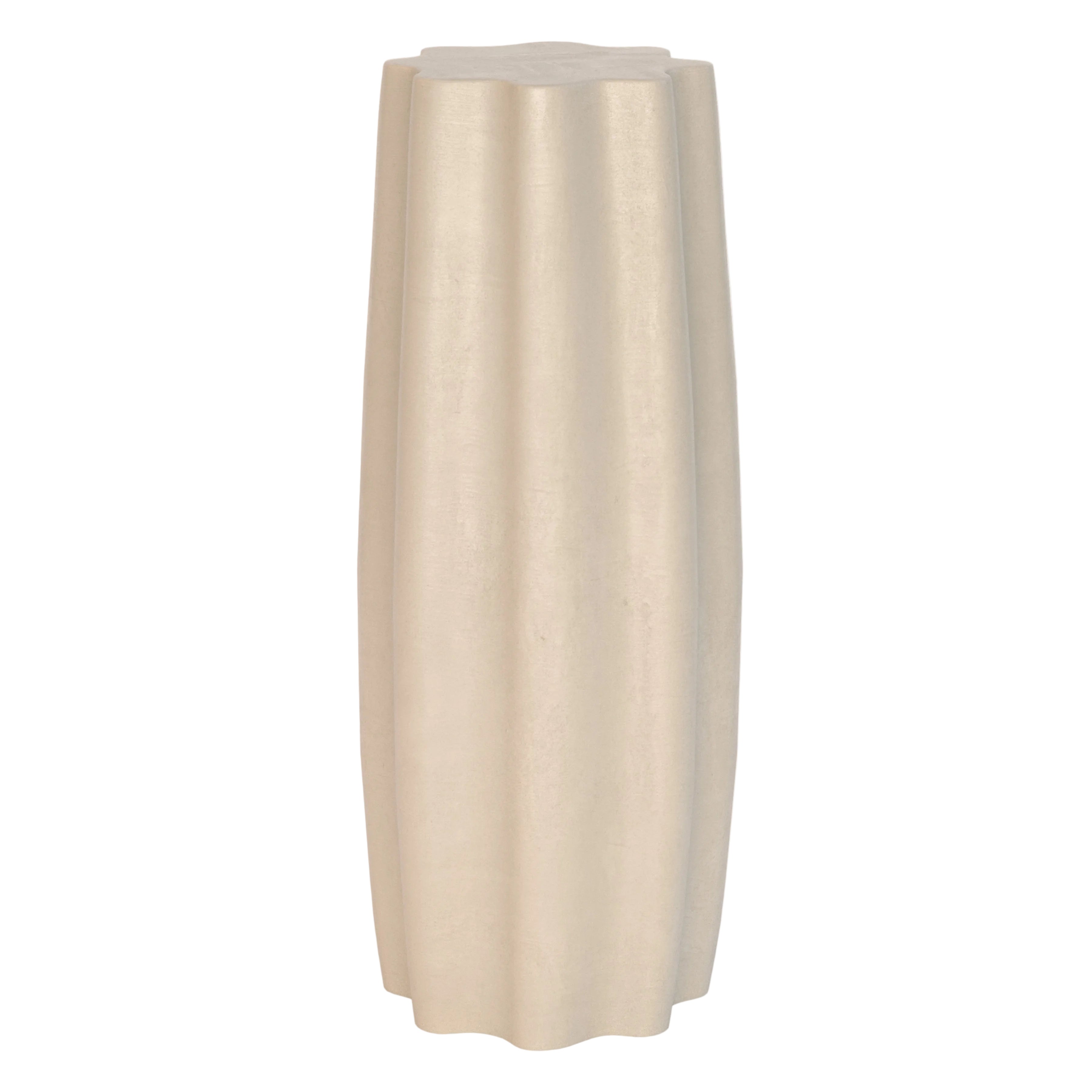 Beige cylindrical side table on a white background