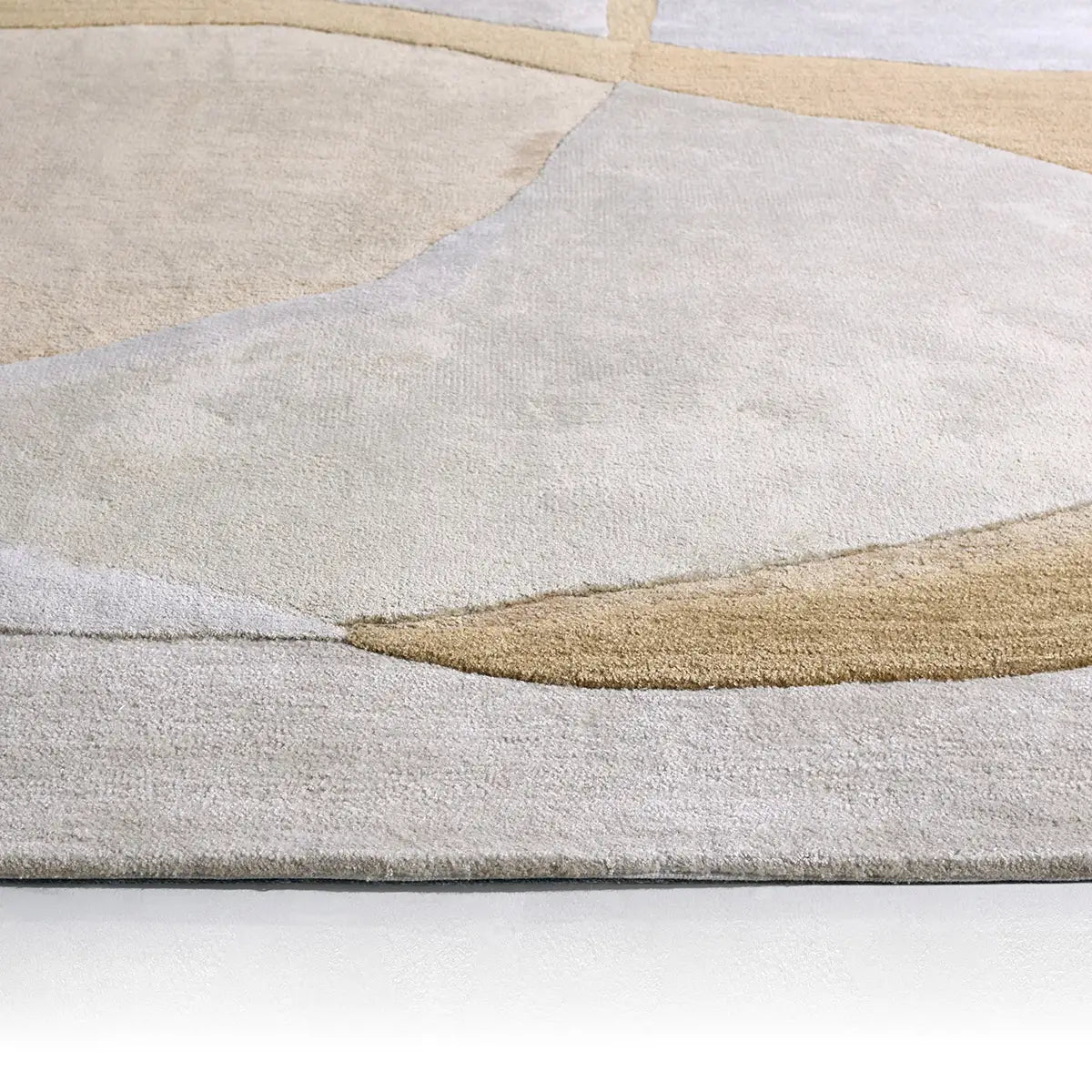 Close-up of a textured area rug with geometric pattern on a white background