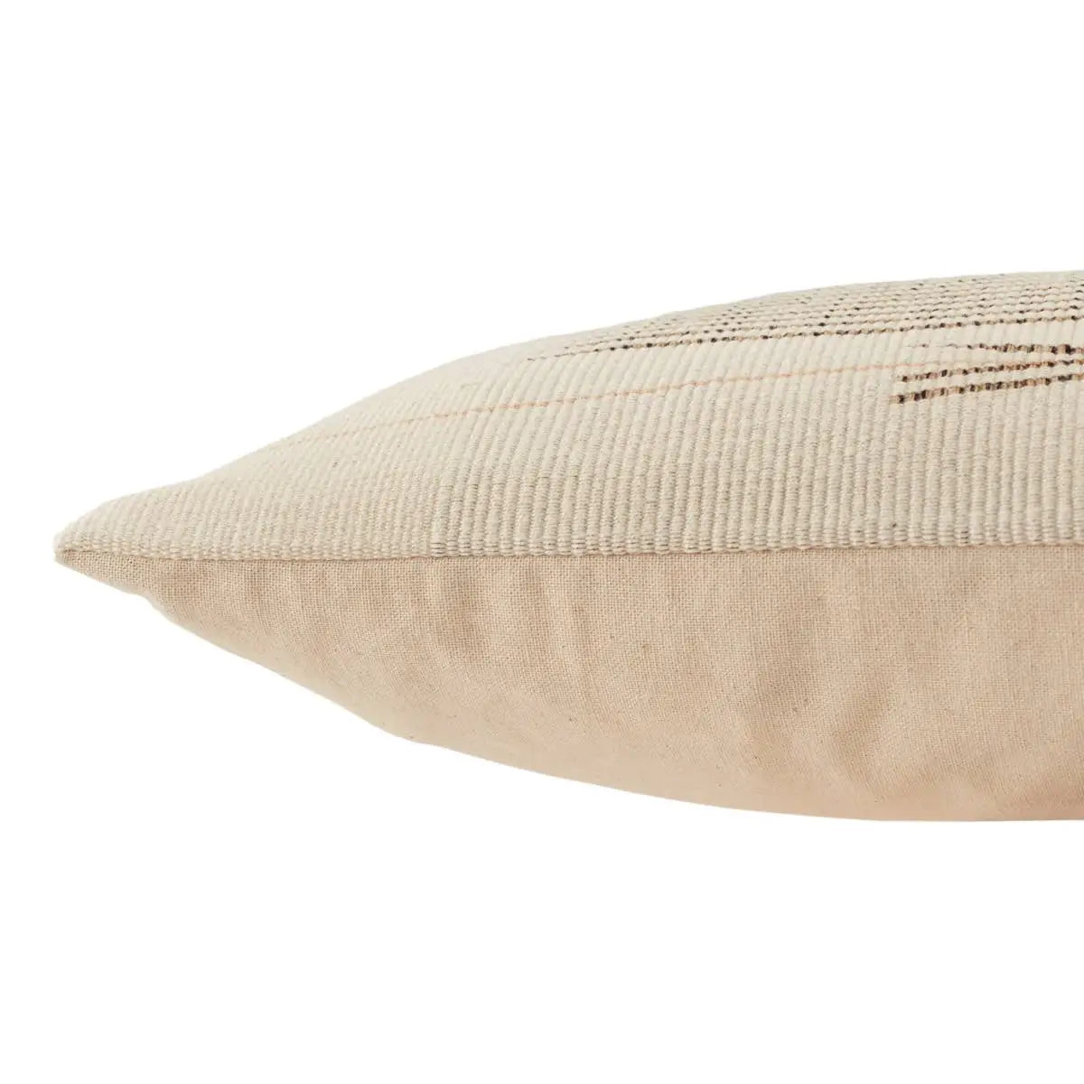 Beige pillow with textured surface on a white background