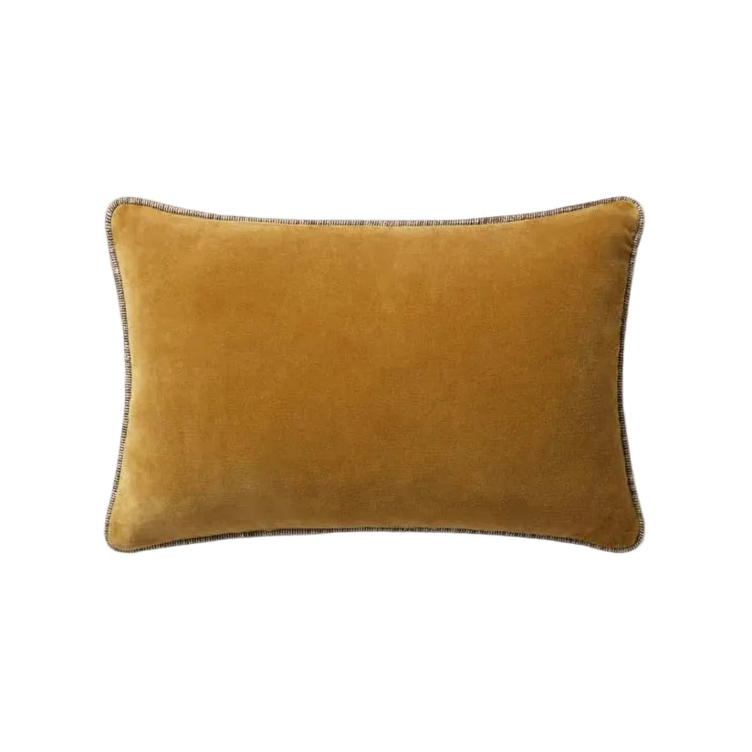 Mustard yellow pillow on a white background