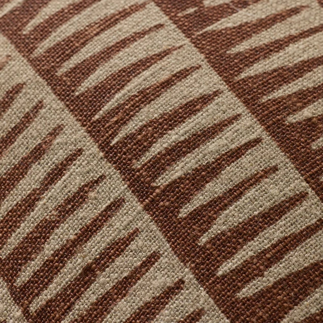 Close-up of a textured fabric with brown and beige pattern