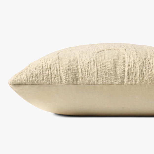 Beige textured pillow on a white background