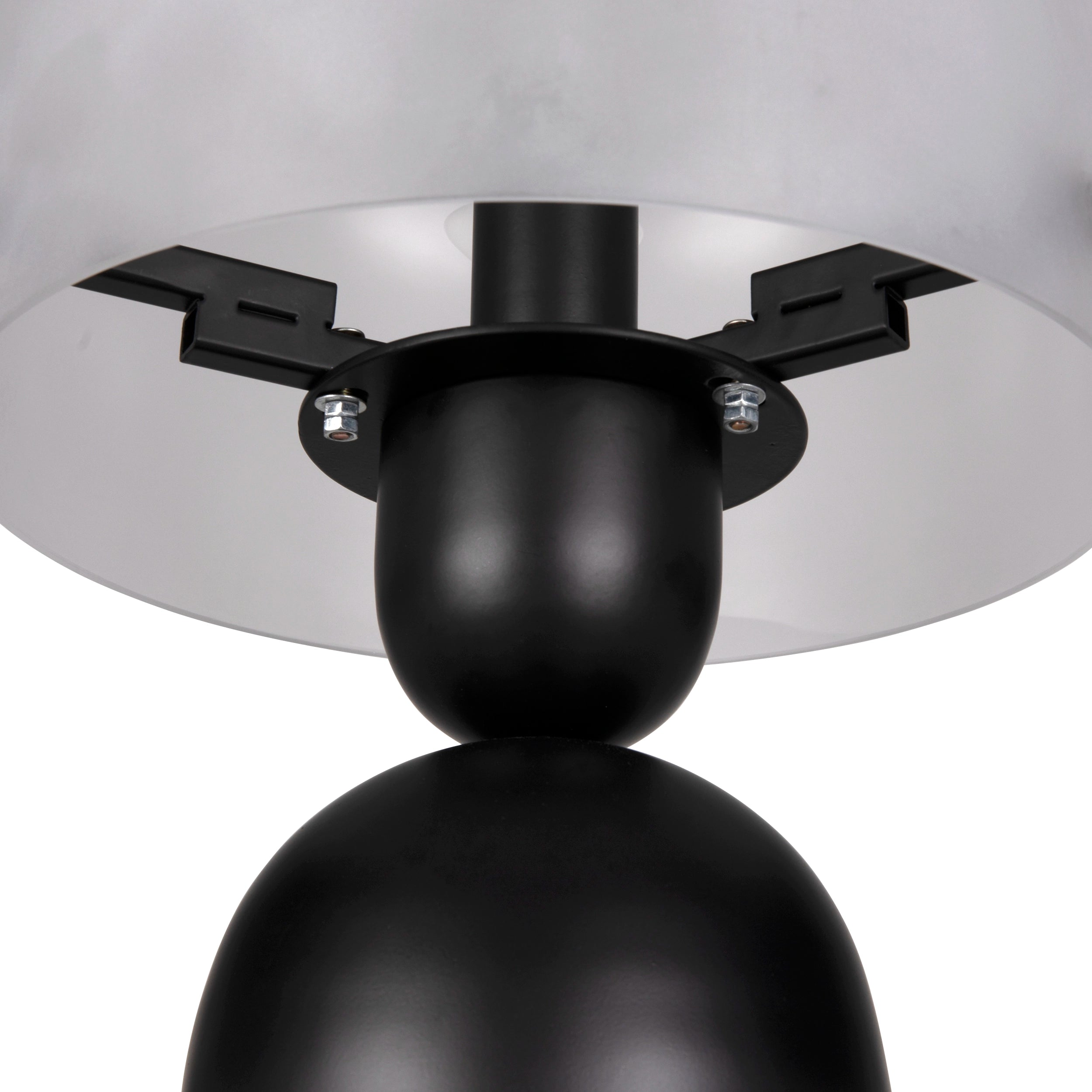 Close-up of a ceiling light fixture with black and silver design on a white background